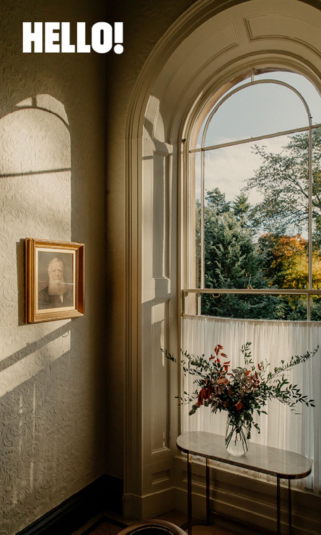 beautiful arched window with sun streaming in 