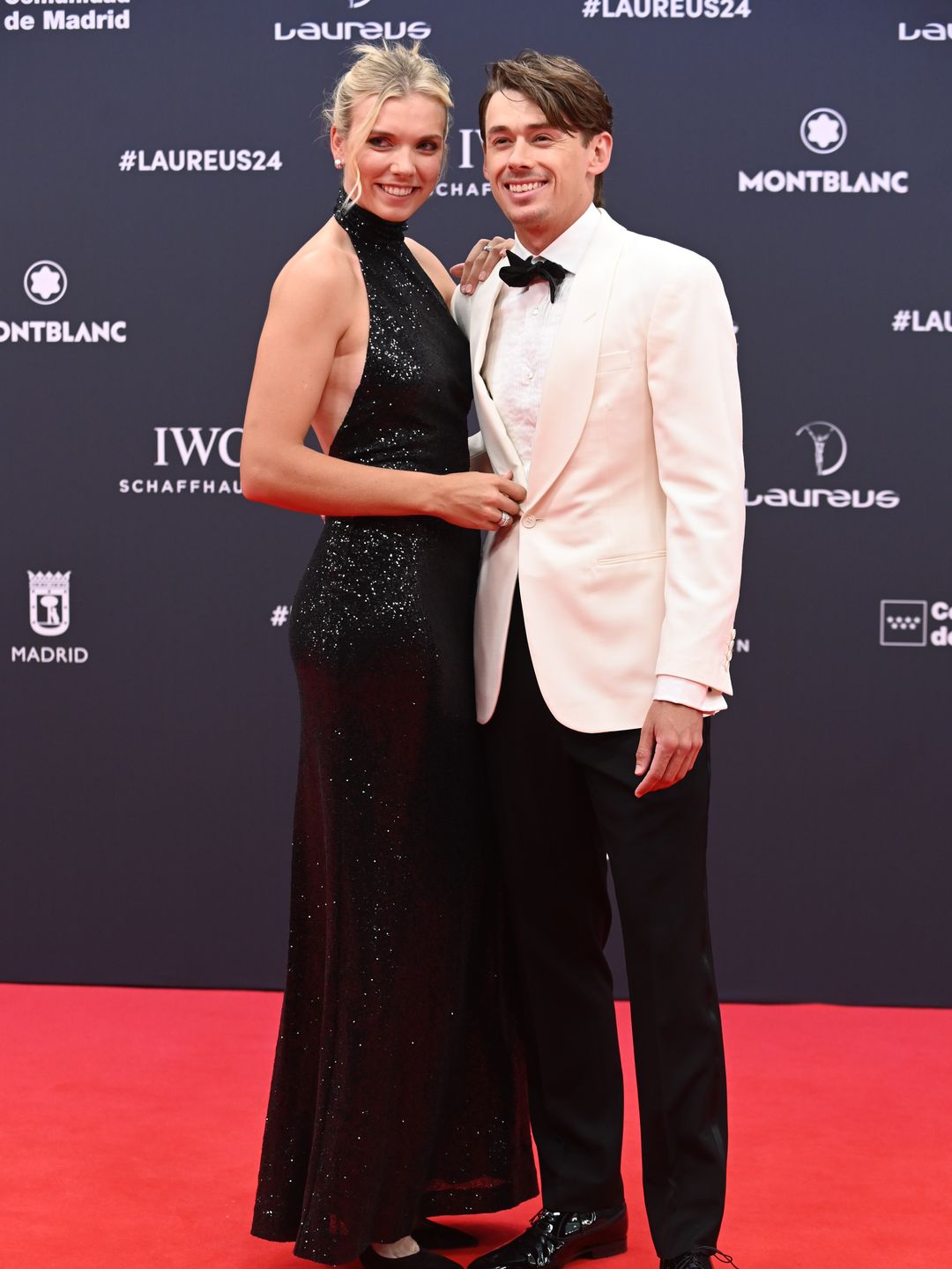 Katie Boulter and Alex de Minaur pose on red carpet