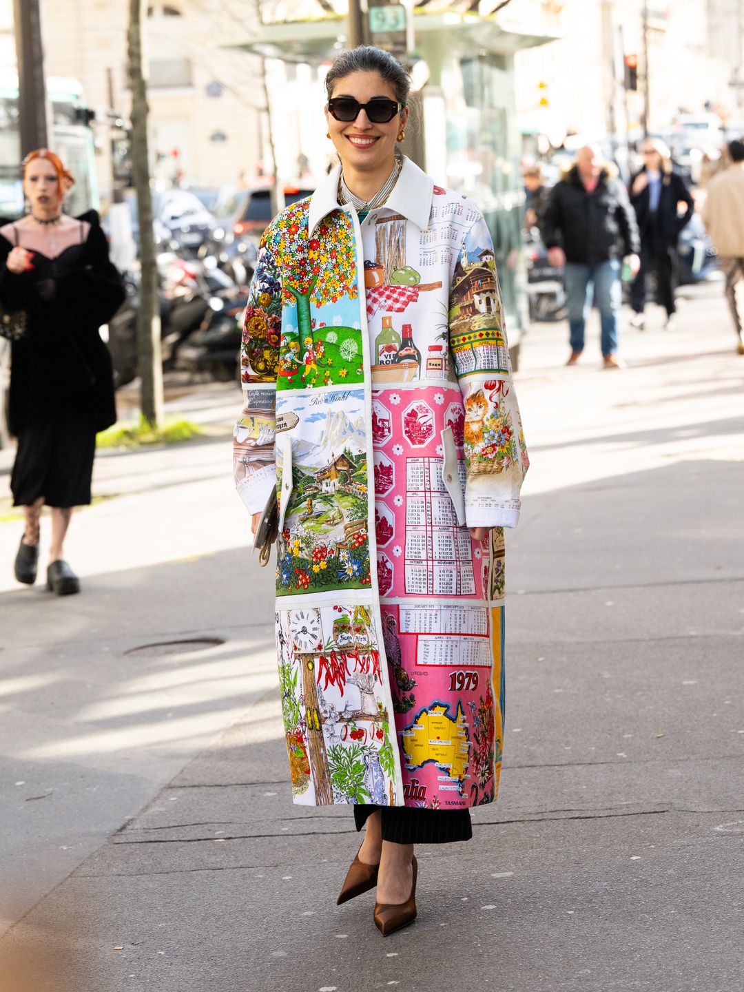 Caroline Issa wears a stunning patchwork Marine Serre coat during Paris Fashion Week.