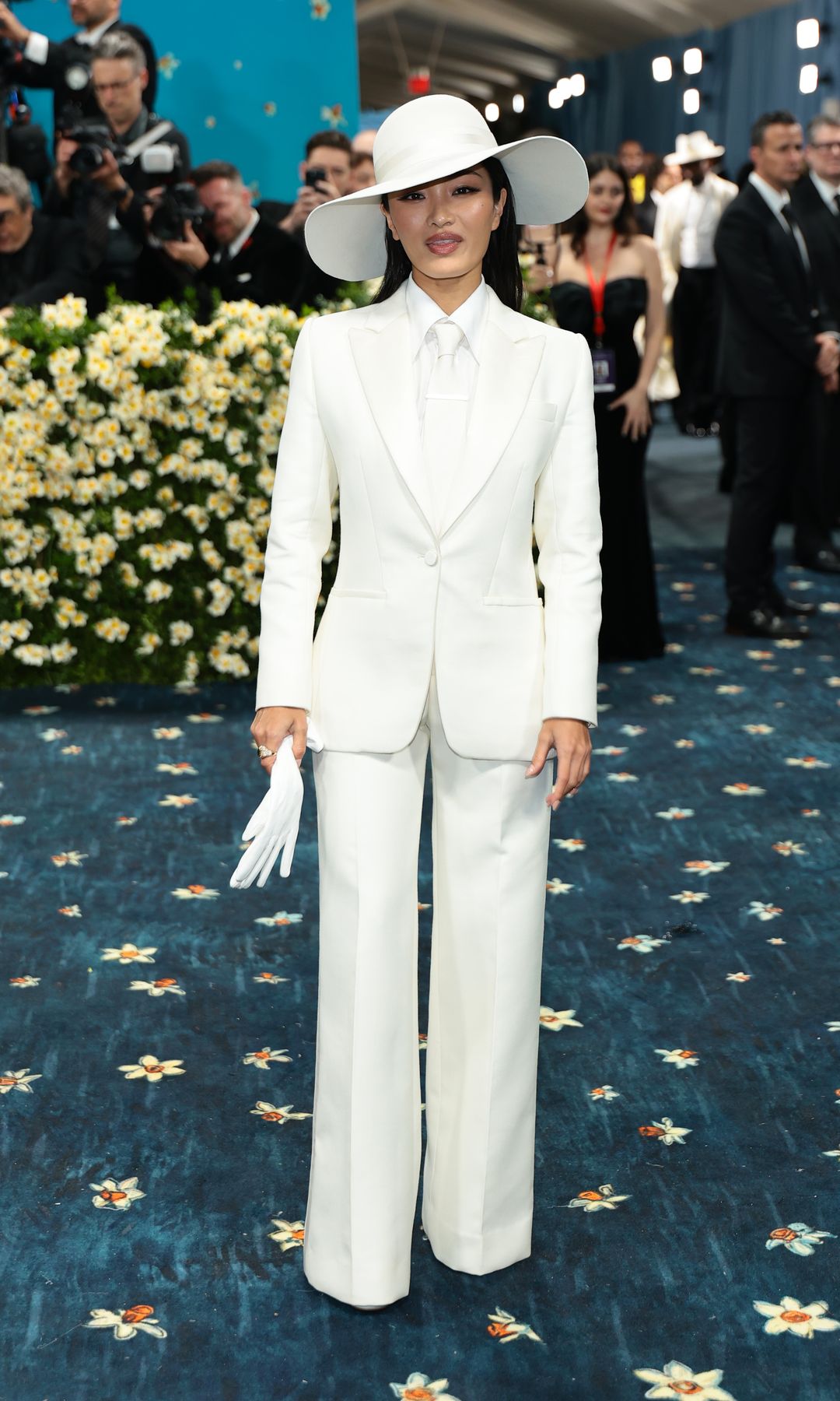 Anna Sawai attends the 2025 Met Gala in Dior white suit
