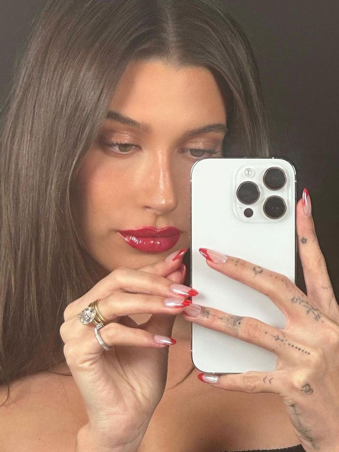 Hailey Bieber shows off her red-tipped festive nails 