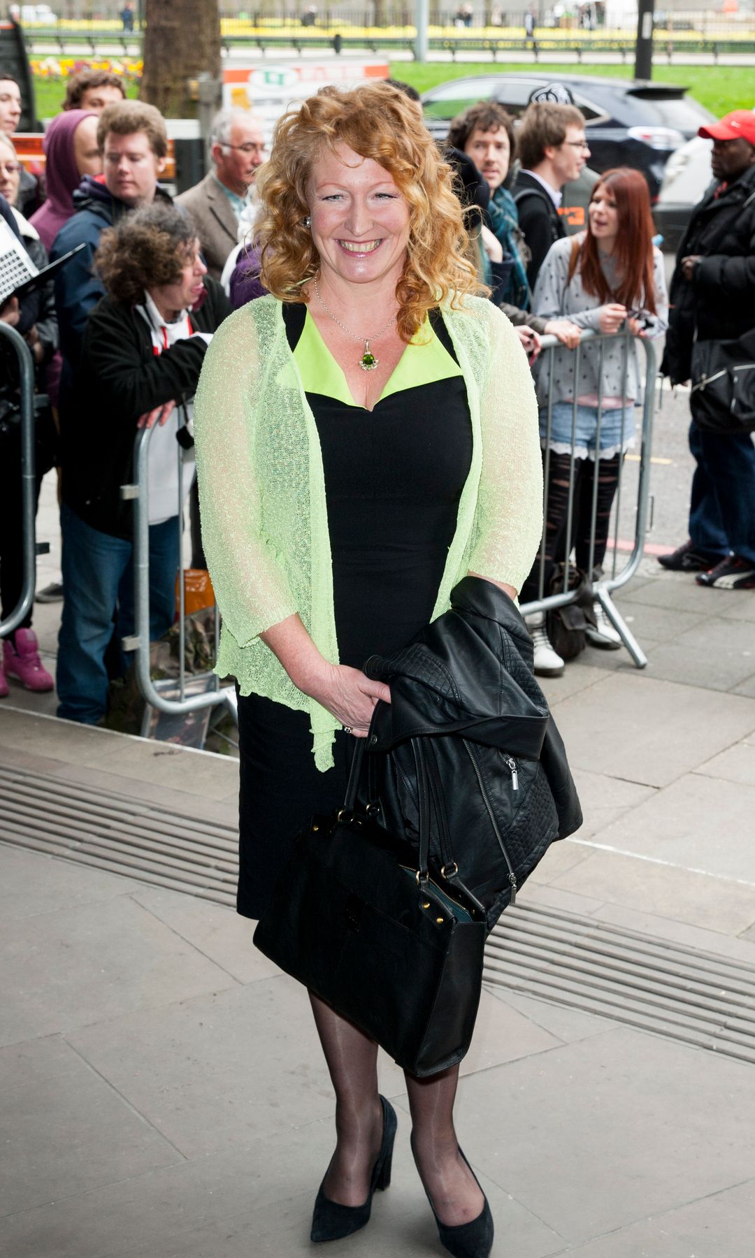 Charlie Dimmock at the TRIC Awards in a black dress and green sheer blouse