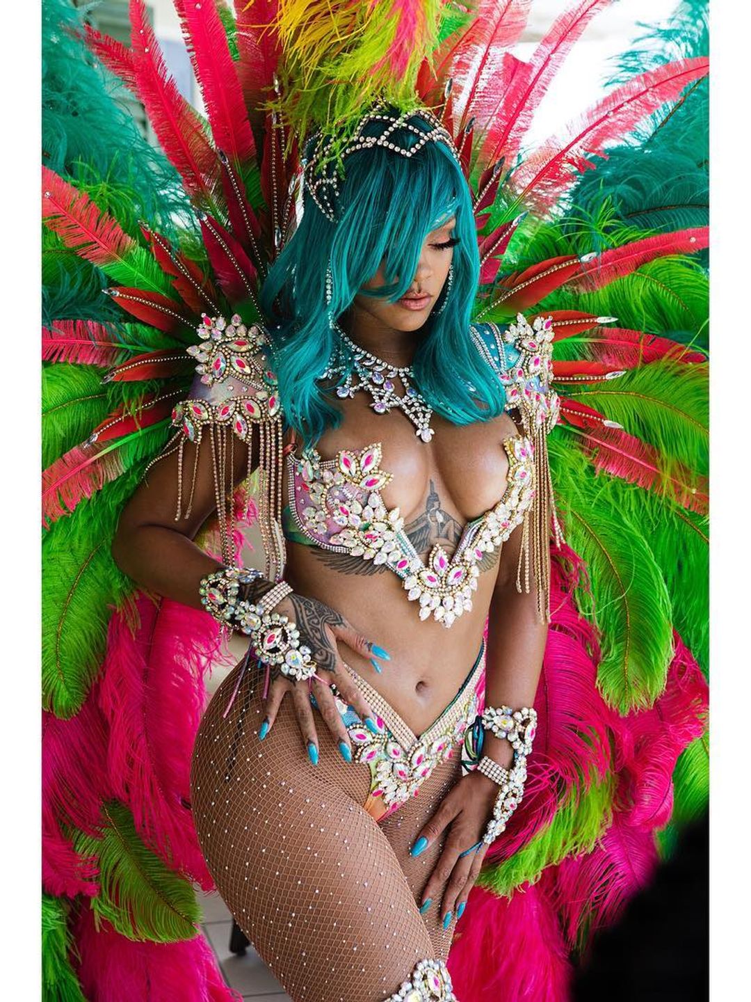 Rihanna in a bejewelled feathered ensemble in Barbados