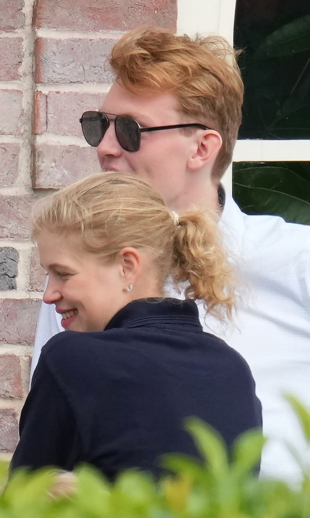 Lady Louise Windsor smiling and leaning towards Felix da Silva-Clamp