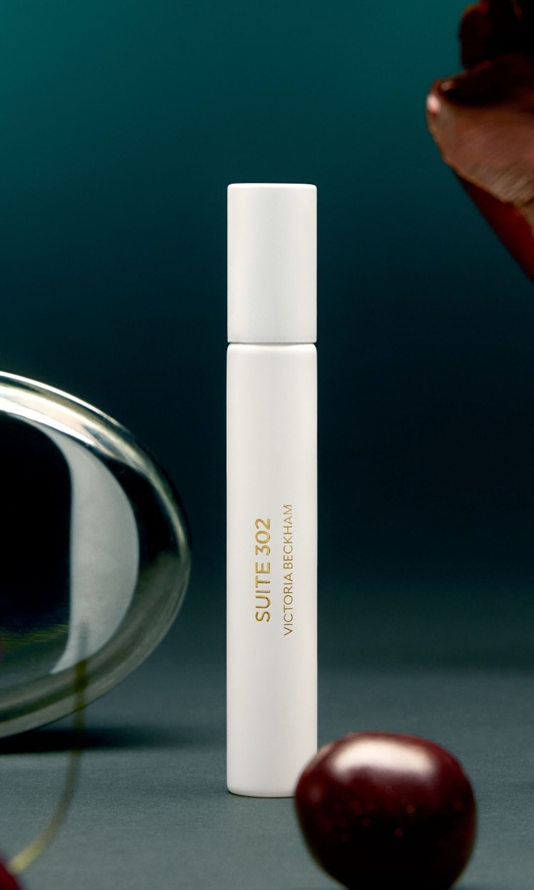 A photo of Victoria Beckhams travel size Suite 302 perfume 