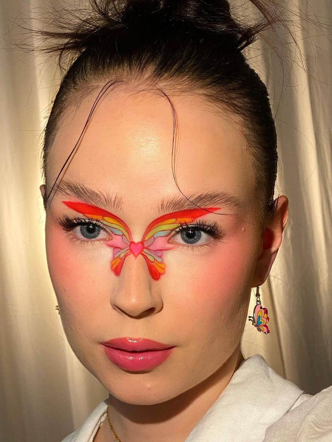 Woman with butterfly central makeup 