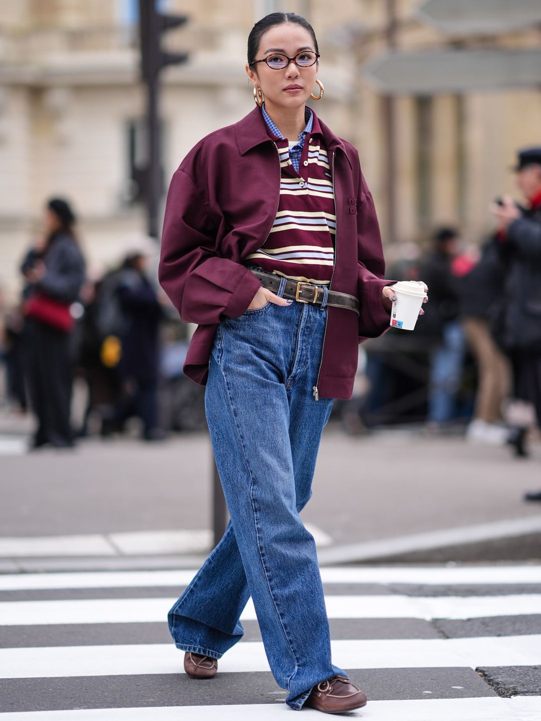 With baggy jeans and gold jewellery