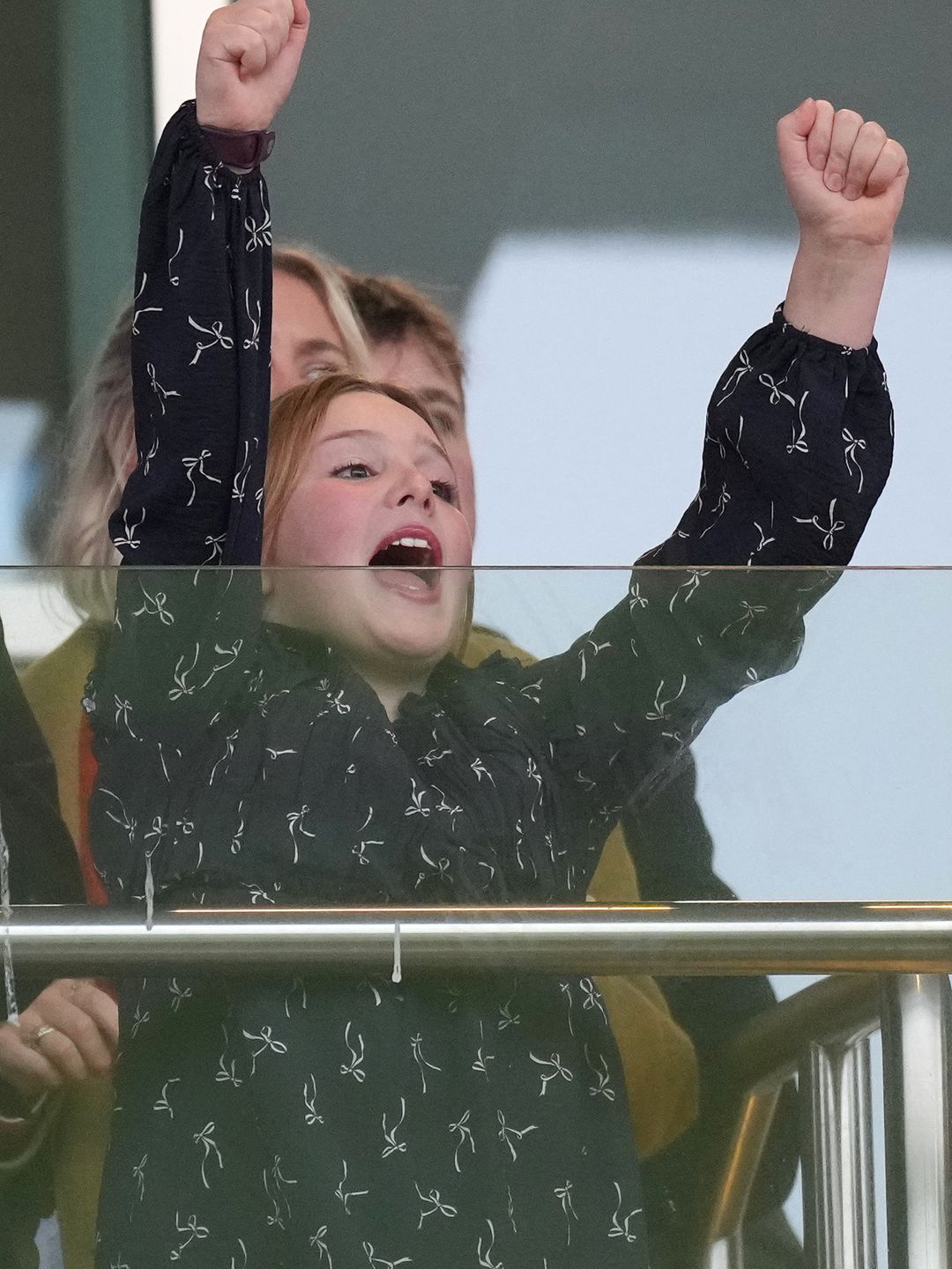 young girl cheering at races