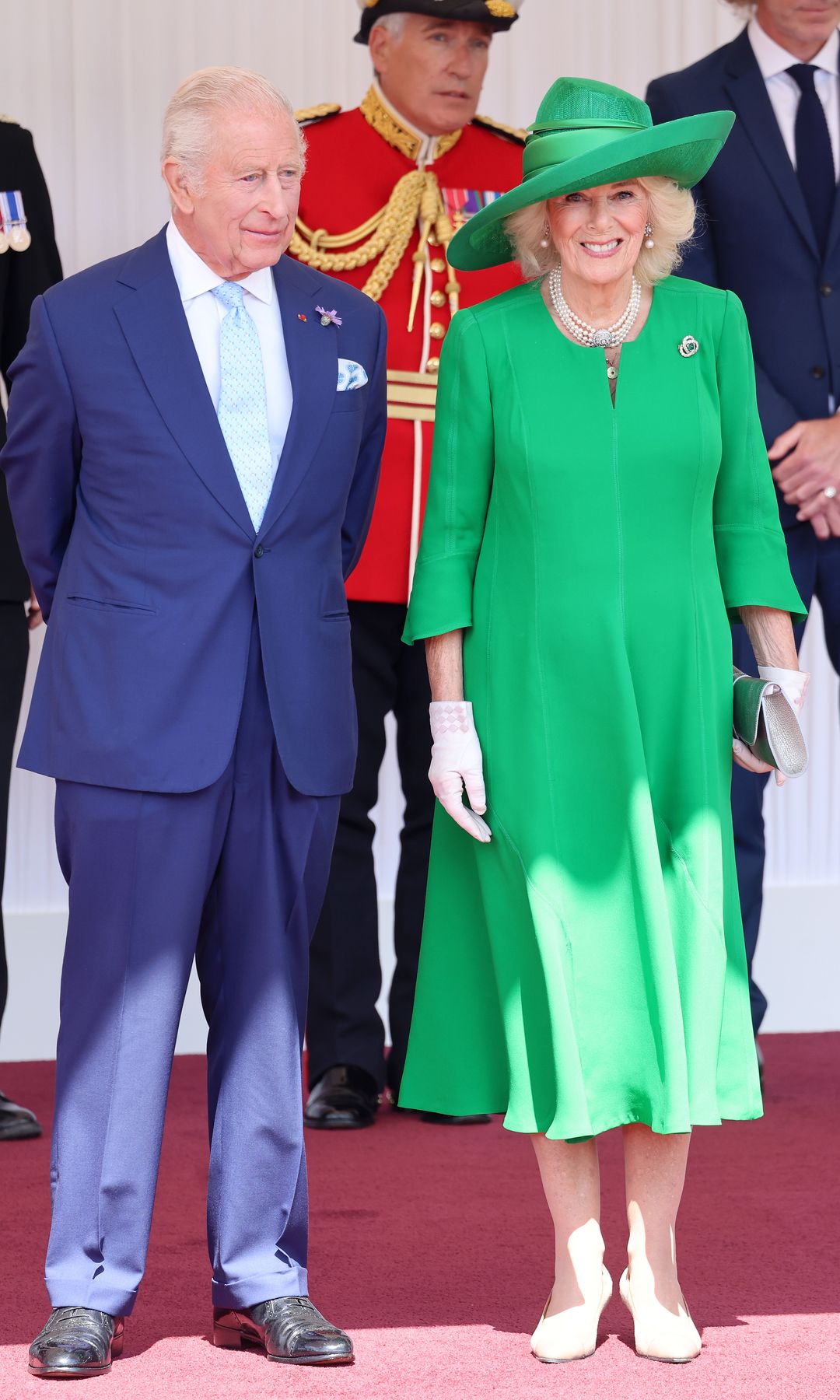 King Charles standing with Queen Camilla
