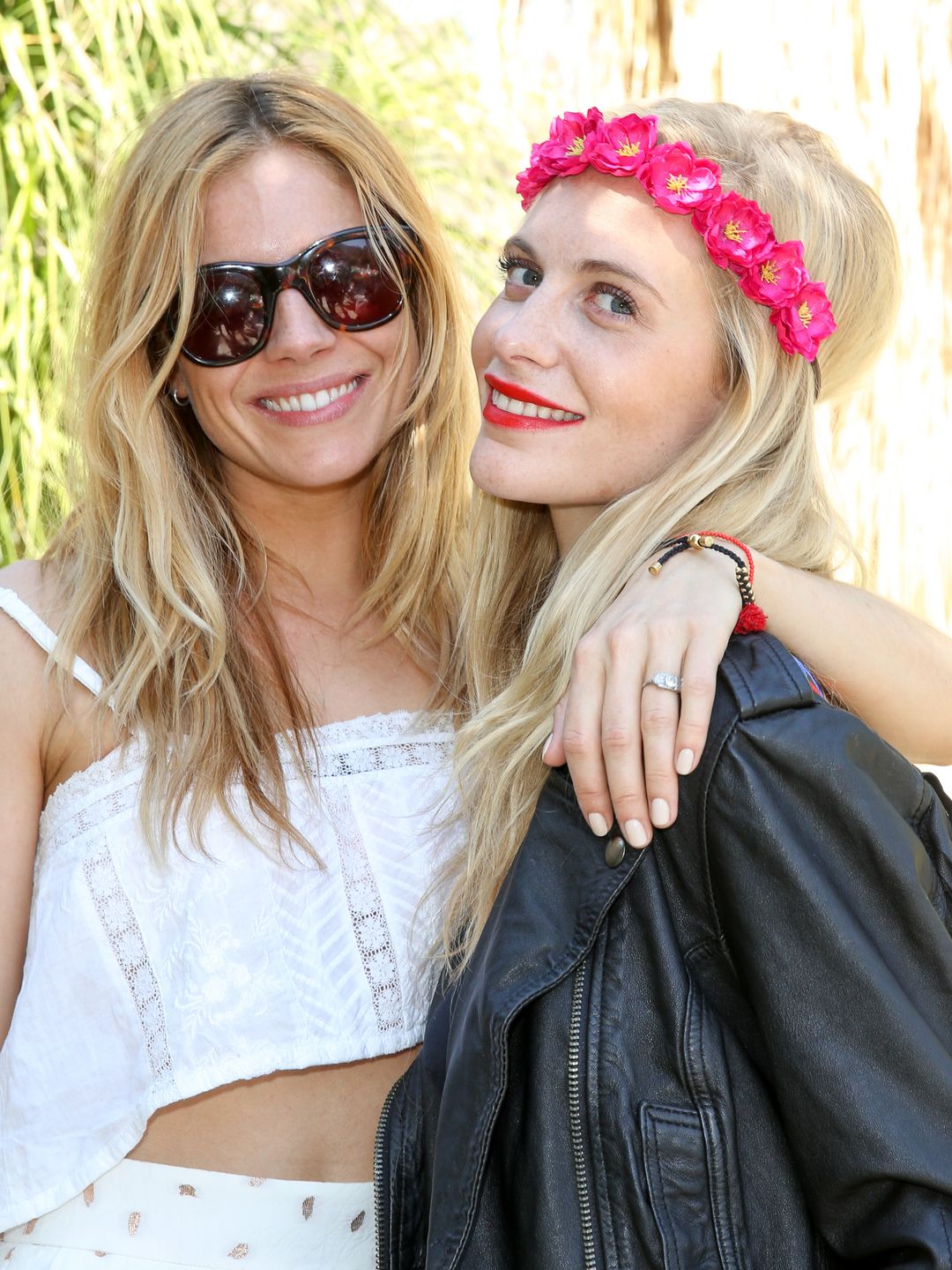 Actress Sienna Miller (L) and model Poppy Delevingne attend the Superdry Coachella brunch hosted by Poppy Delevingne 