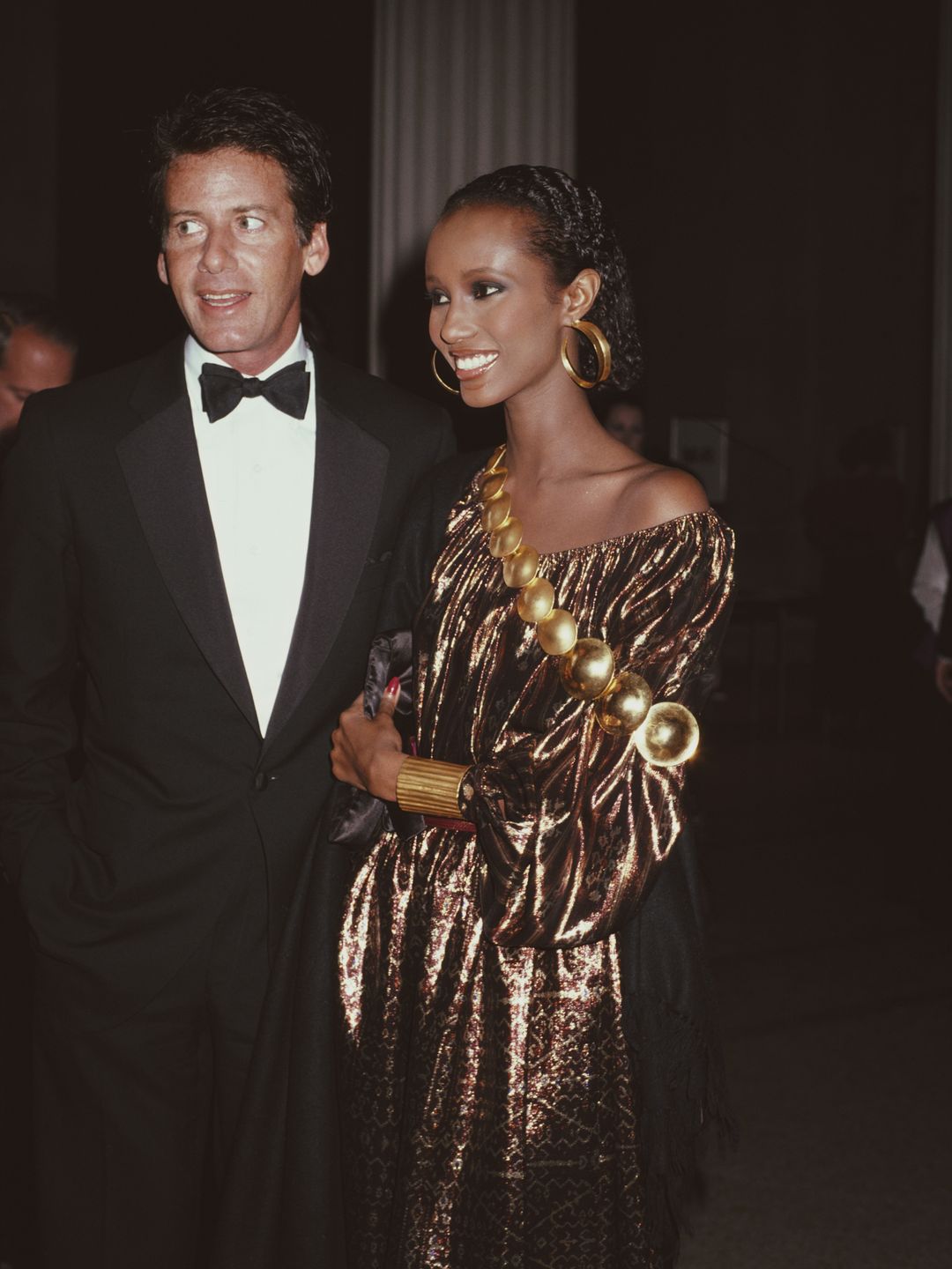 American fashion designer Calvin Klein and Somali fashion model Iman at the Met Gala, Metropolitan Museum of Art, New York City, USA, December 1981. (Photo by Rose Hartman/Archive Photos/Getty Images)