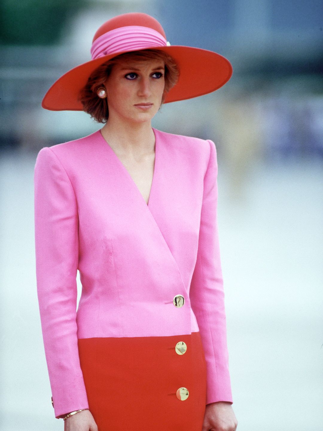Princess Diana wearing a clashing red and pink Catherine Walker outfit
