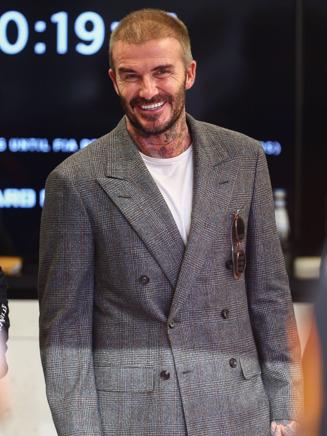 David Beckham in a tweed jacket and white shirt