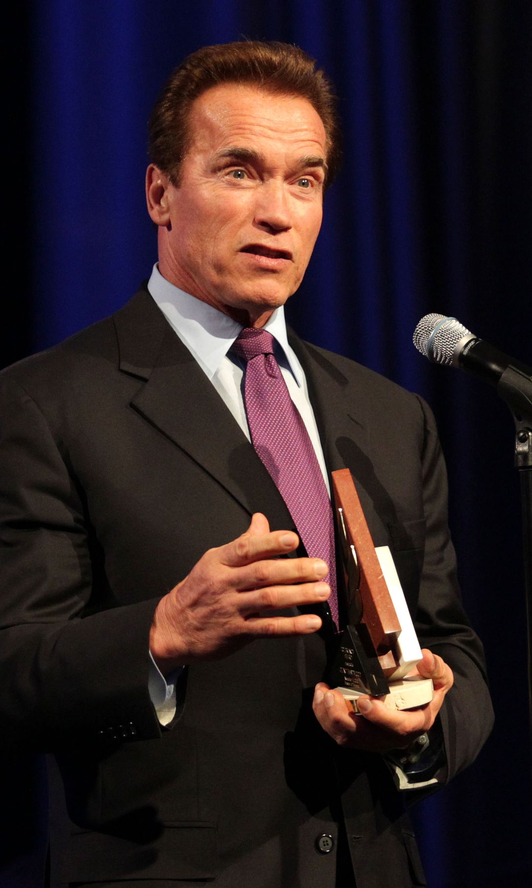 Arnold Schwarzenegger delivering a speech