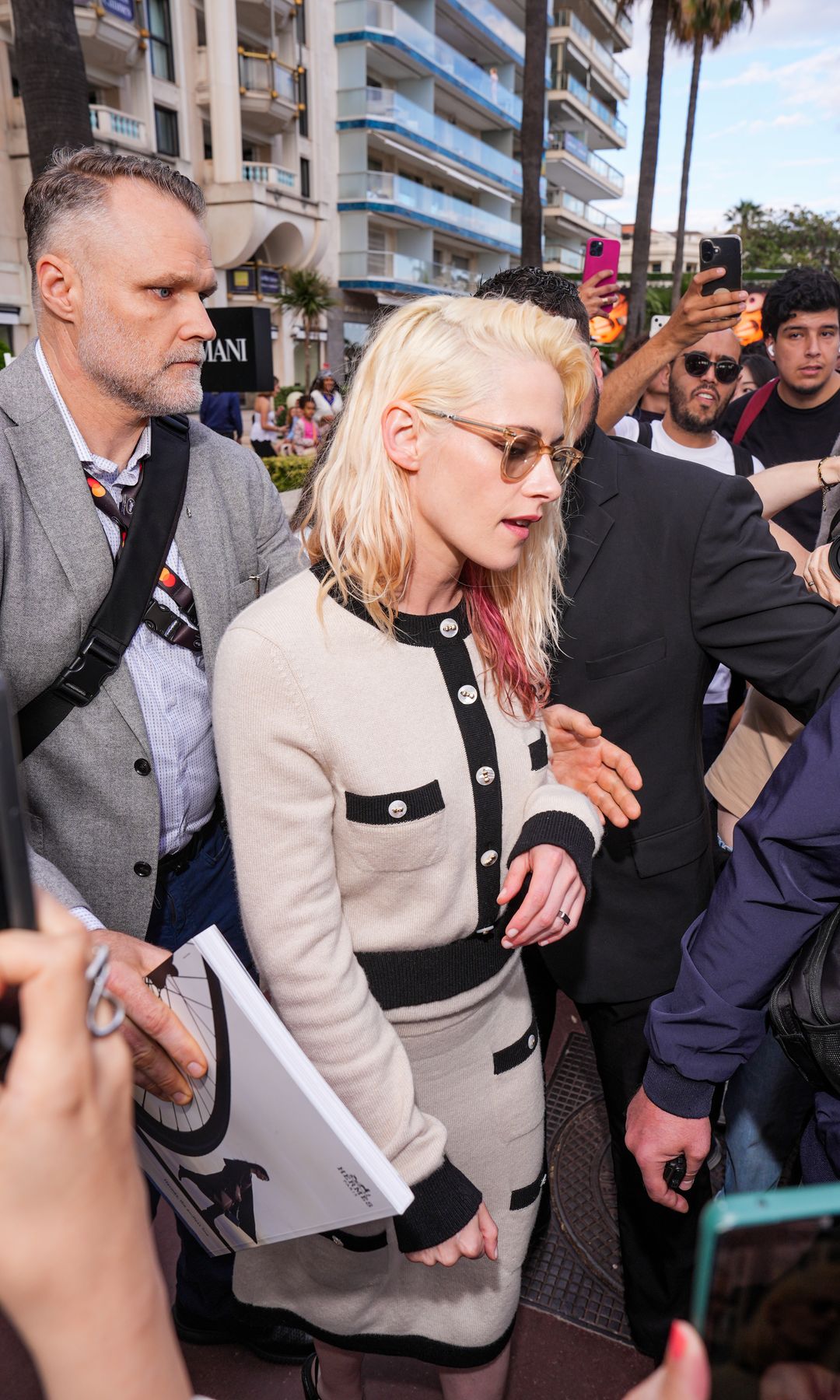 Kristen Stewart in a beige outfit leaving Cannes