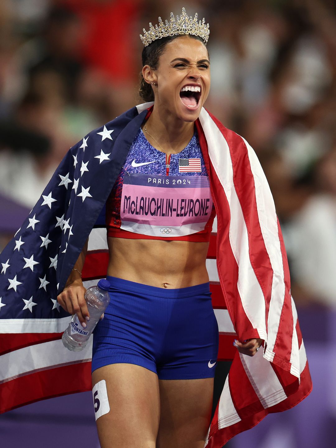 Team USA's Sydney McLaughlin-Levrone celebrates winning the gold medal after competing in the Women's 400m Hurdles final