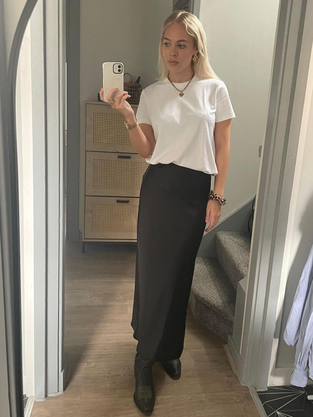 Lauren Ramsay wearing a white T-shirt and a maxi black skirt 