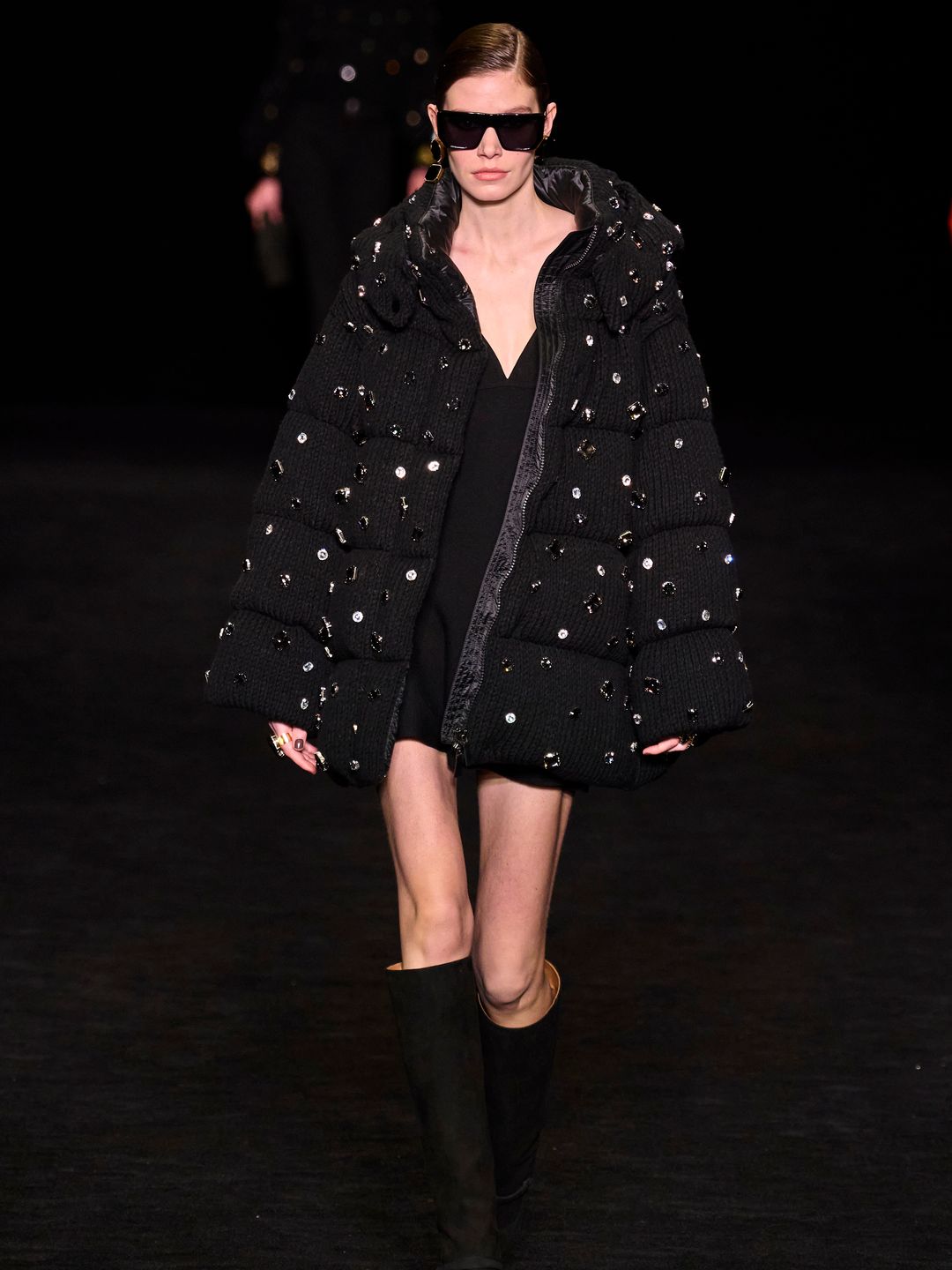 Model wearing crystal-adorned puffer coat 