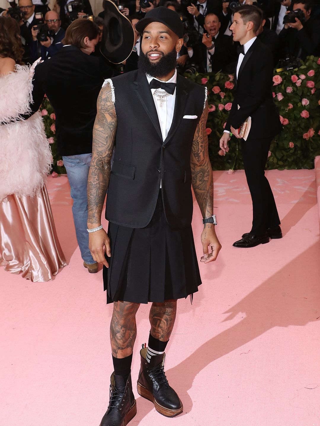 Odell Beckham Jr. wears a pleated skirt and cut off blazer to the Met Gala 