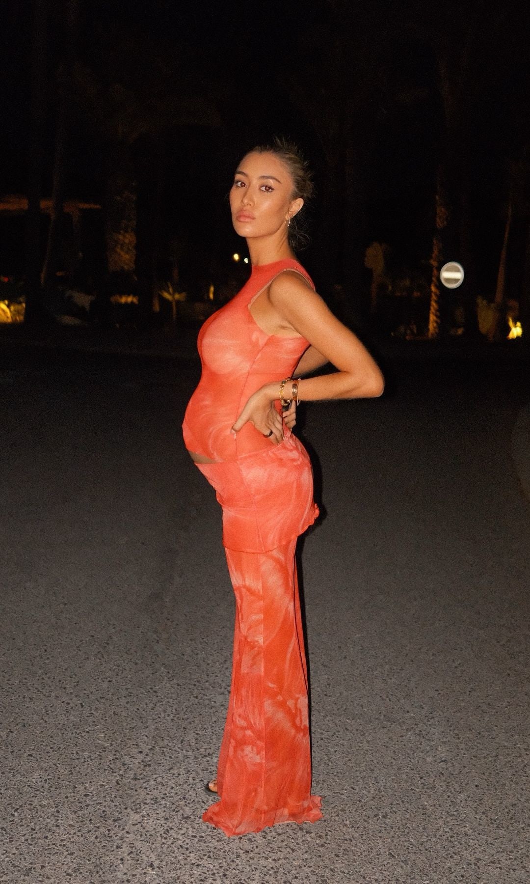 Sophie Habboo poses in orange trousers and a matching top on holiday