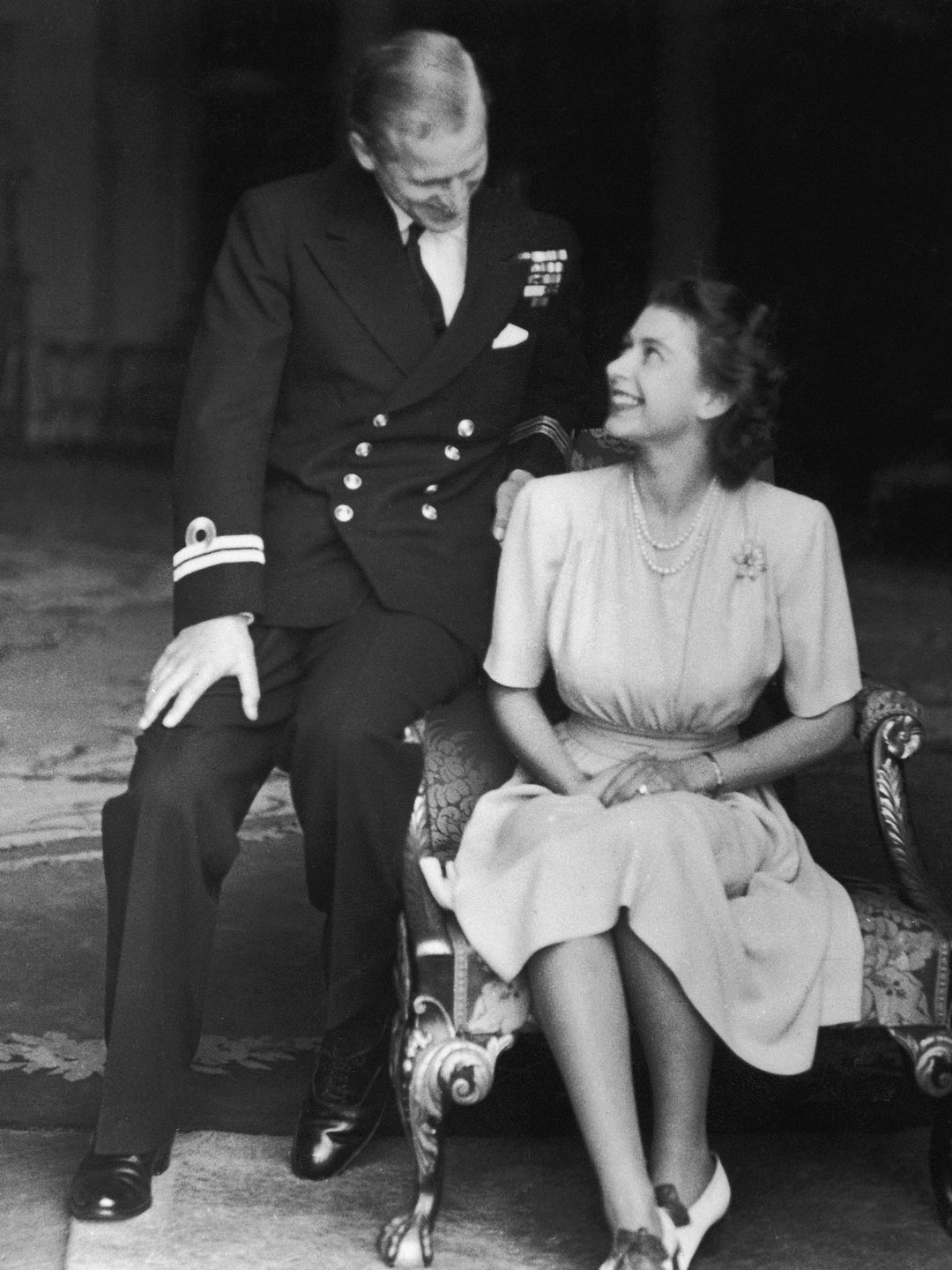 Prince Philip and the Queen sitting with each other