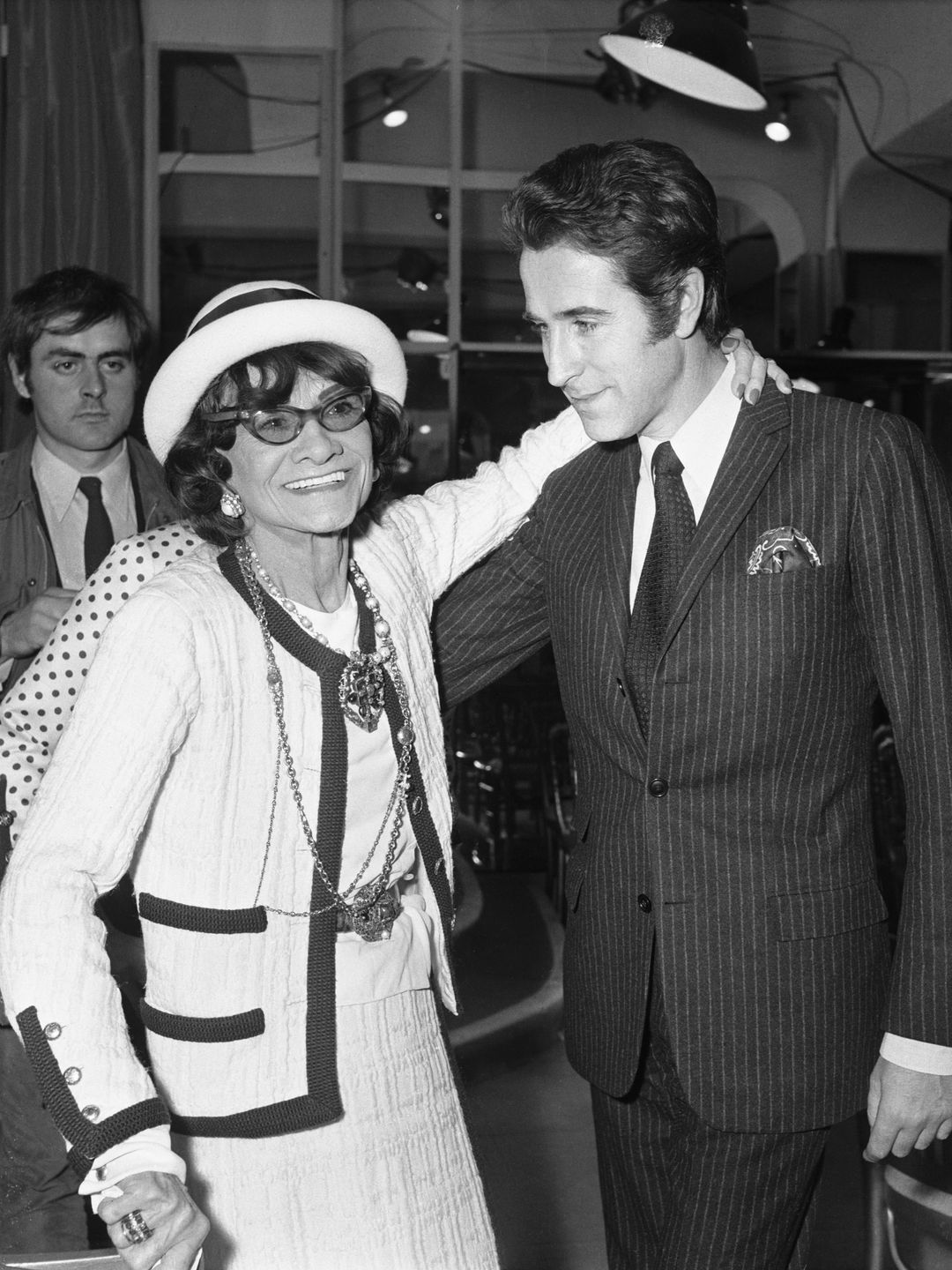 Fashion designer Coco Chanel with opera performer Jacques Chazot at her Paris salon.