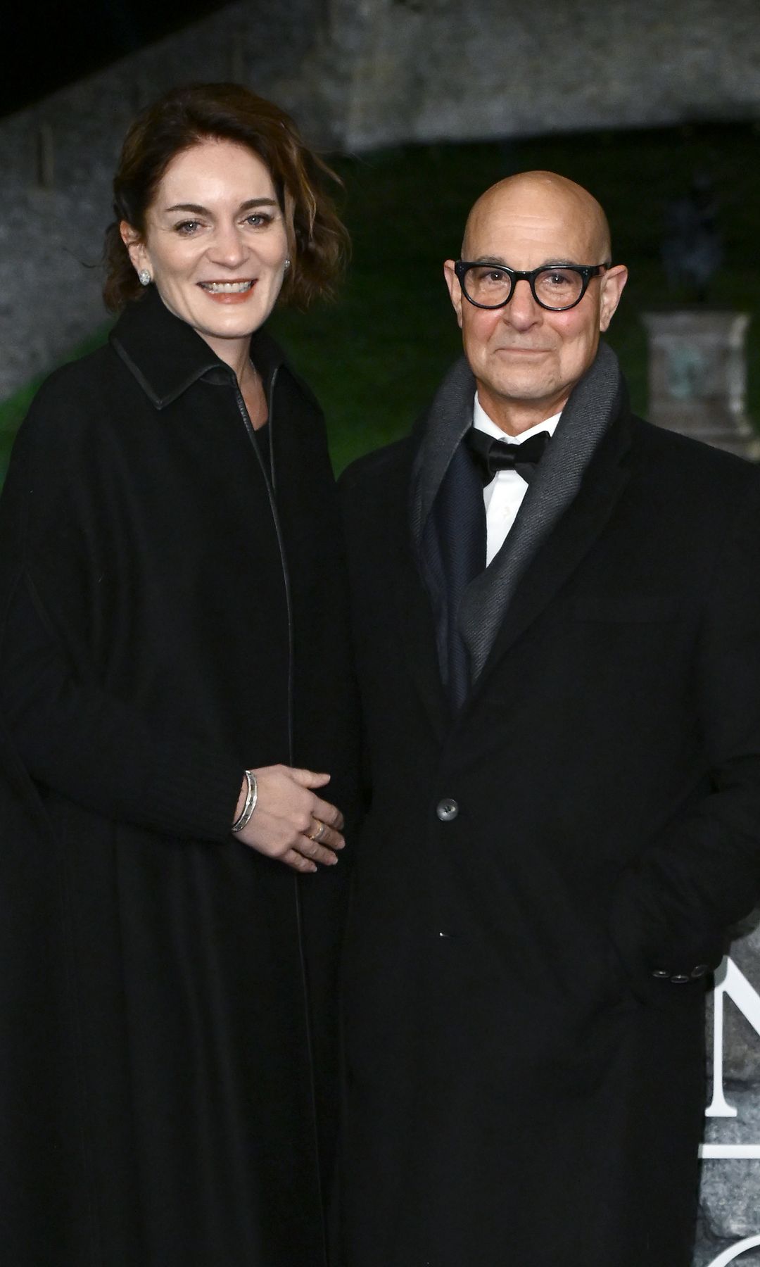 Stanley Tucci standing with Felicity Blunt outside Windsor Castle