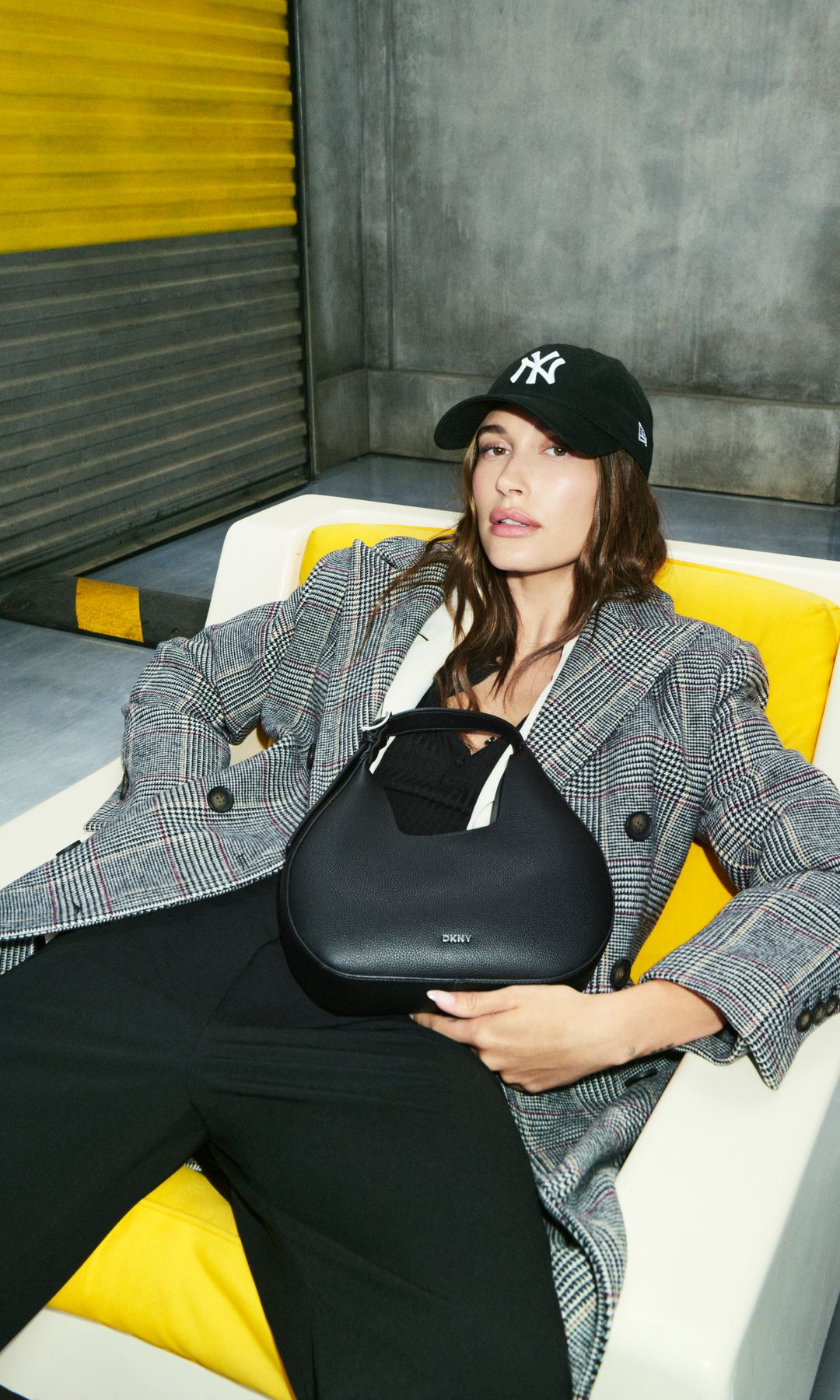 Hailey Bieber poses for the AW25 DKNY campaign 