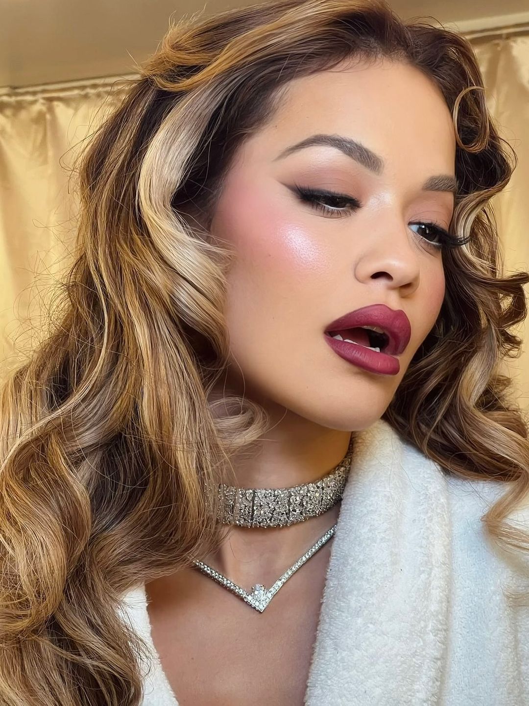 Rita Ora poses for a selfie showing off her glam makeup look