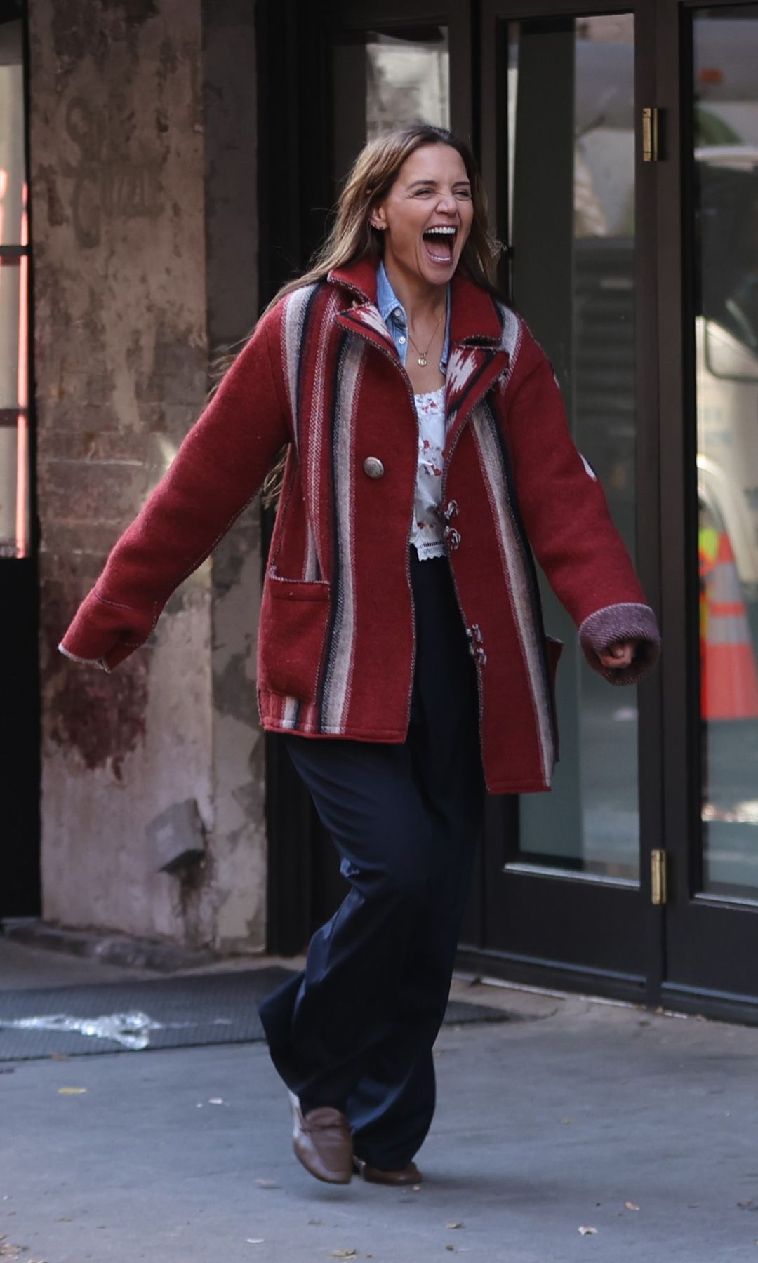 katie holmes in a red Nordic style cardigan