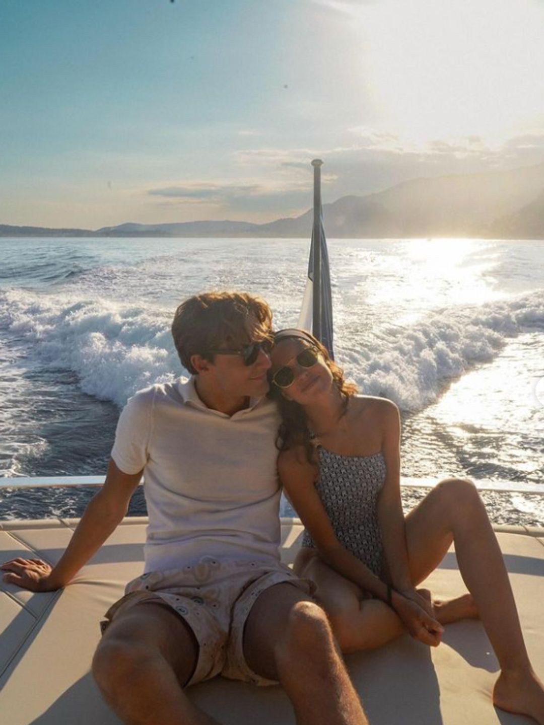 George Russell and Carmen Montero Mundt snuggled together on a boat