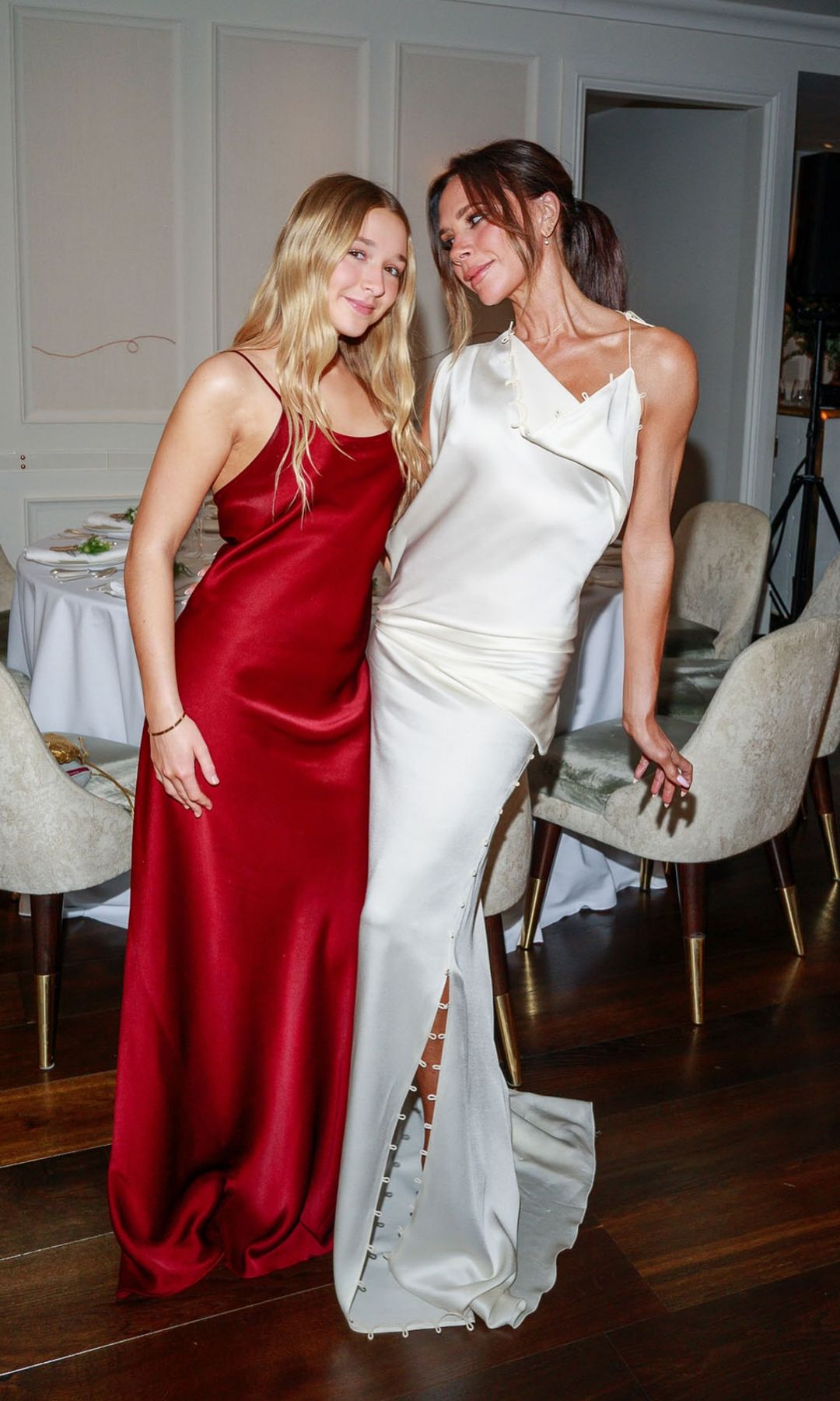 Victoria matches her daughter Harper in matching silky dresses for Davids 50th birthday party