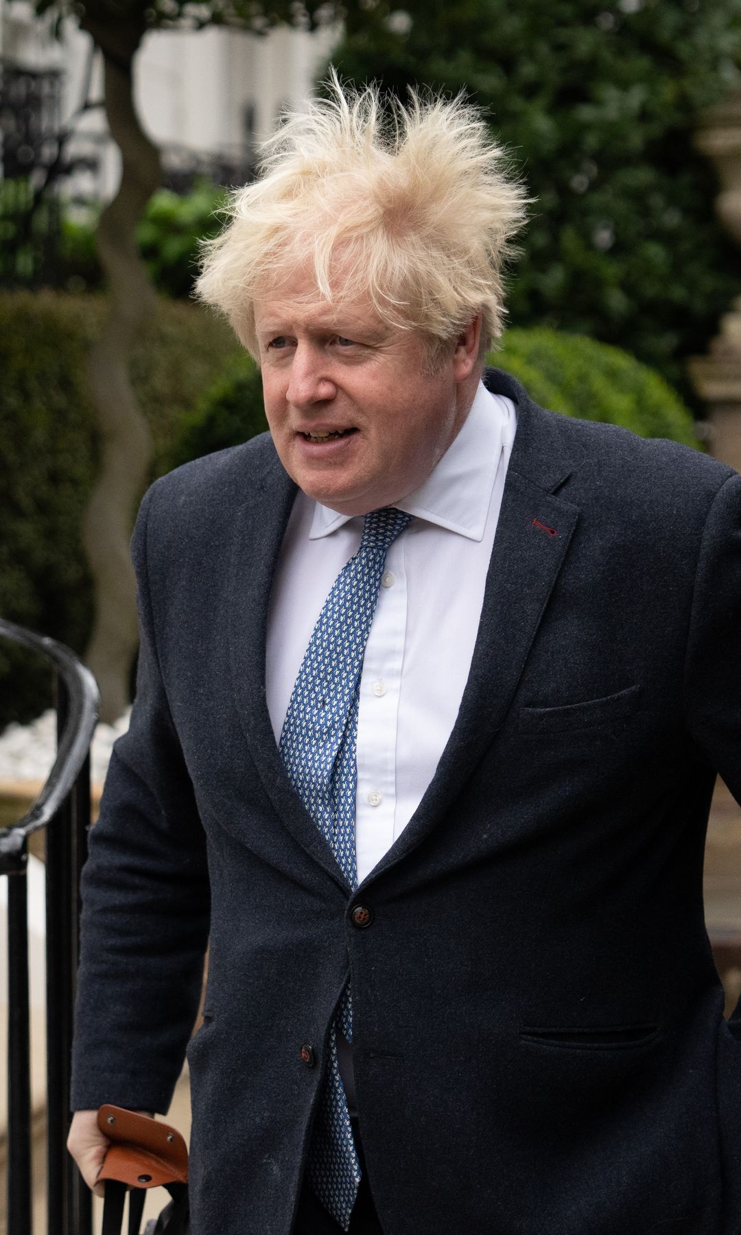 Boris Johnson in a suit with ruffled hair