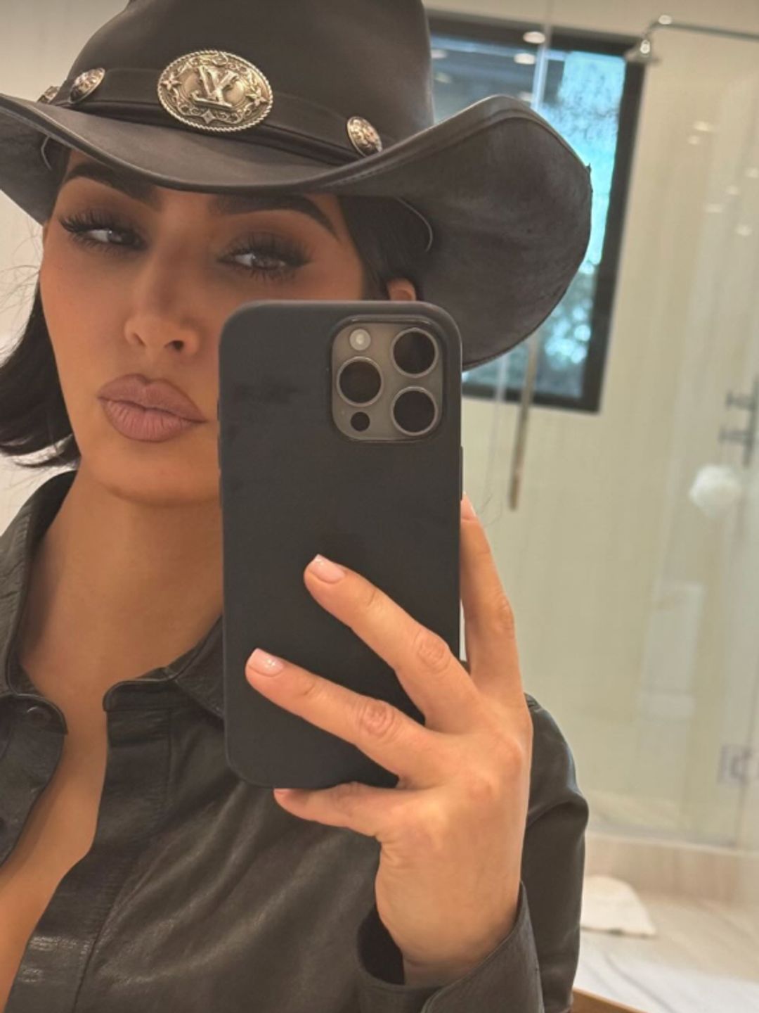 Kim Kardashian rocks a jet black micro bob