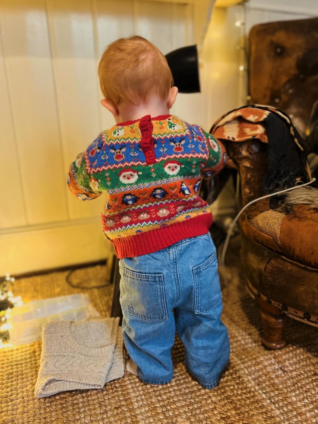 baby girl wearing festive jumper and jeans 