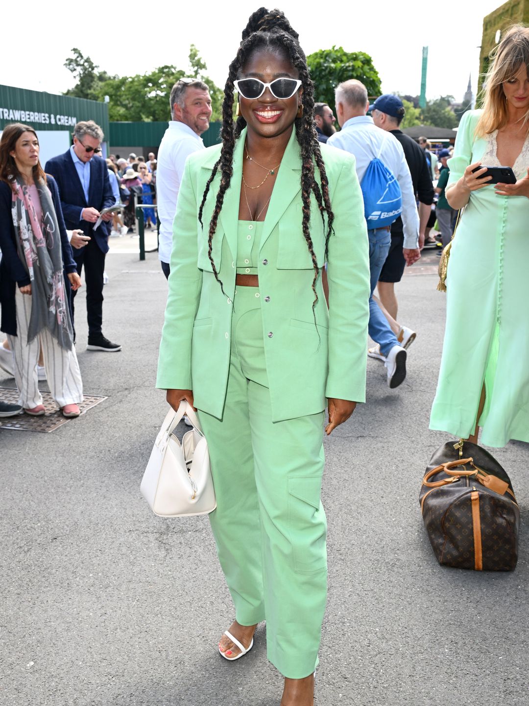 Clara Amfo attended day one of Wimbledon in a mint green suit and white sunglasses. 