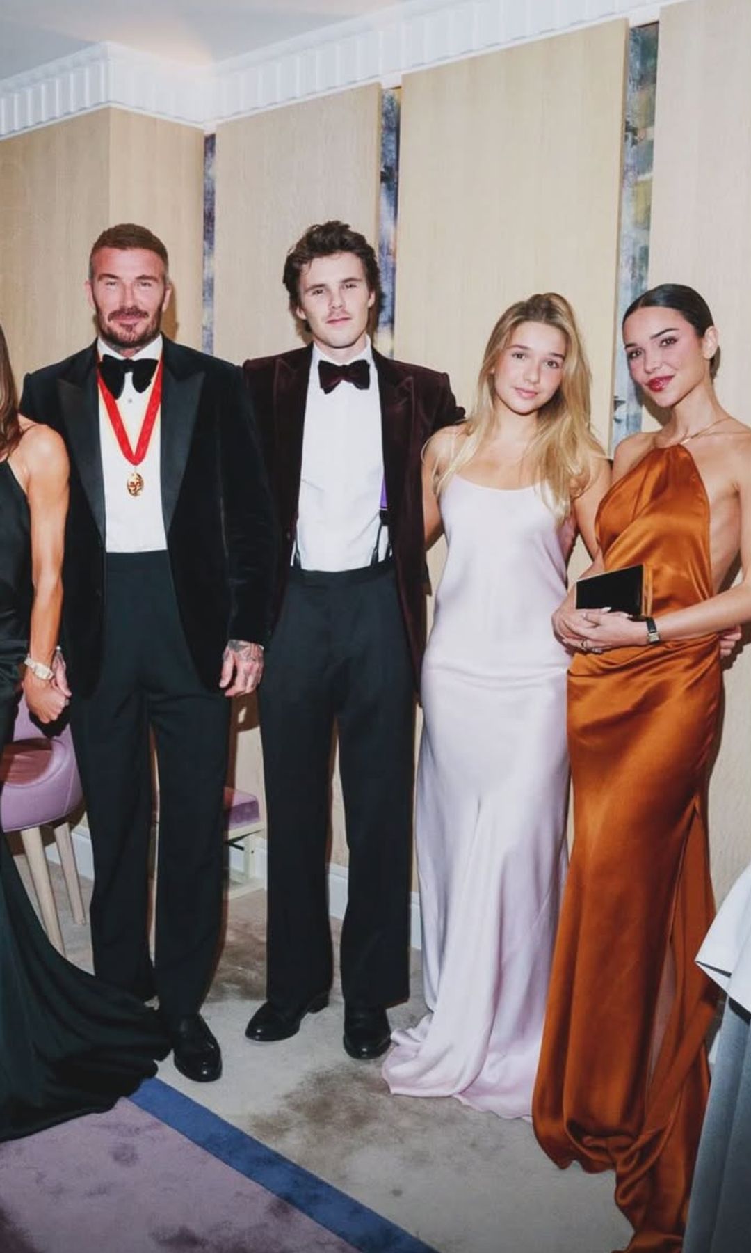 The Beckhams pose for a photo at David's knighthood dinner
