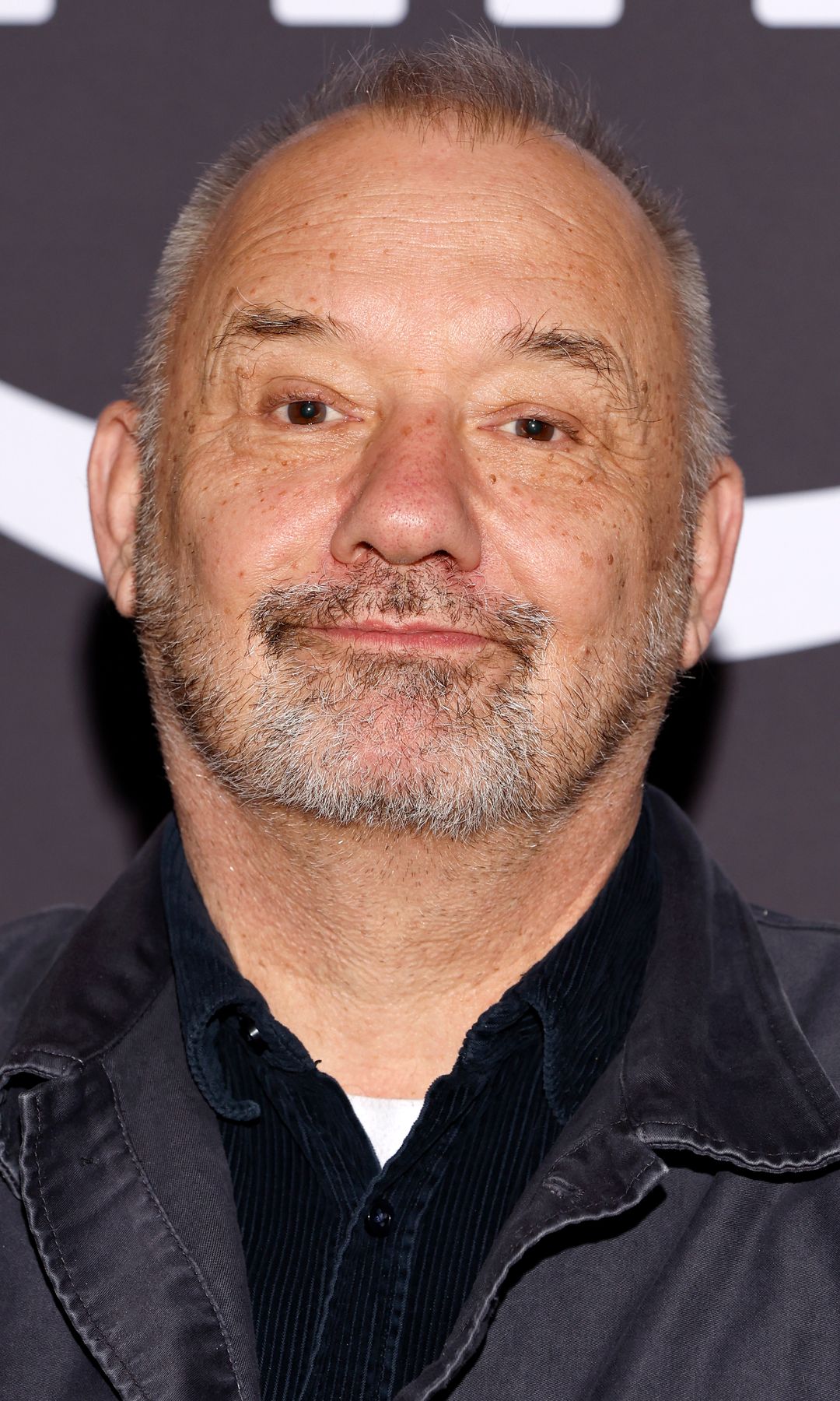 Bob Mortimer in a black denim outfit