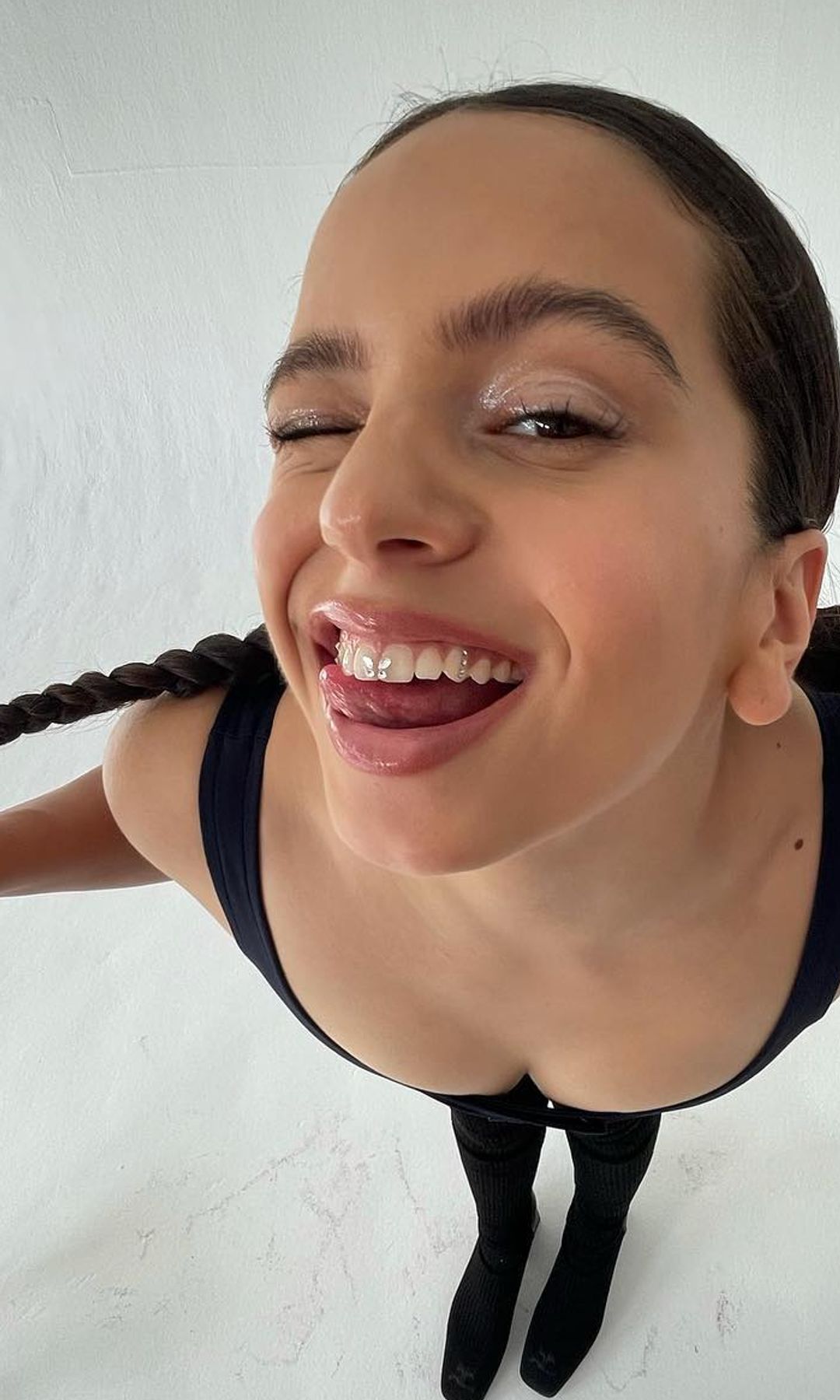 Rosalía smiles for an Instagram picture