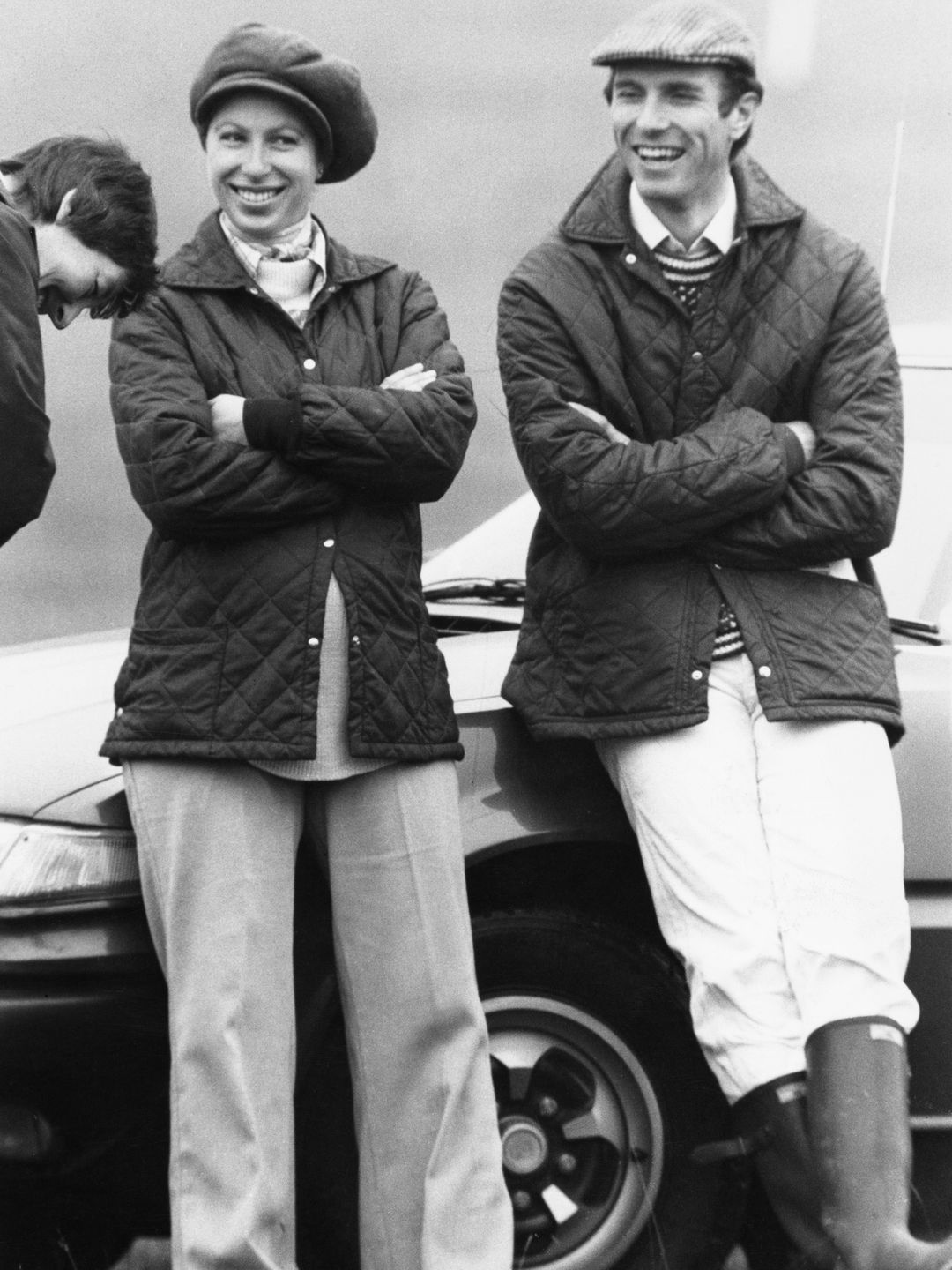 Princess Anne and Mark Phillips folding their arms over their chests