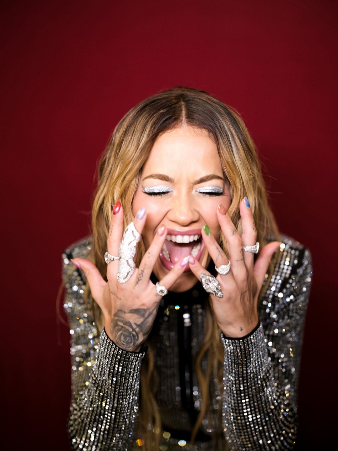 Rita Ora poses on her instagram in a crystal jacket and shows off her stack of diamond rings