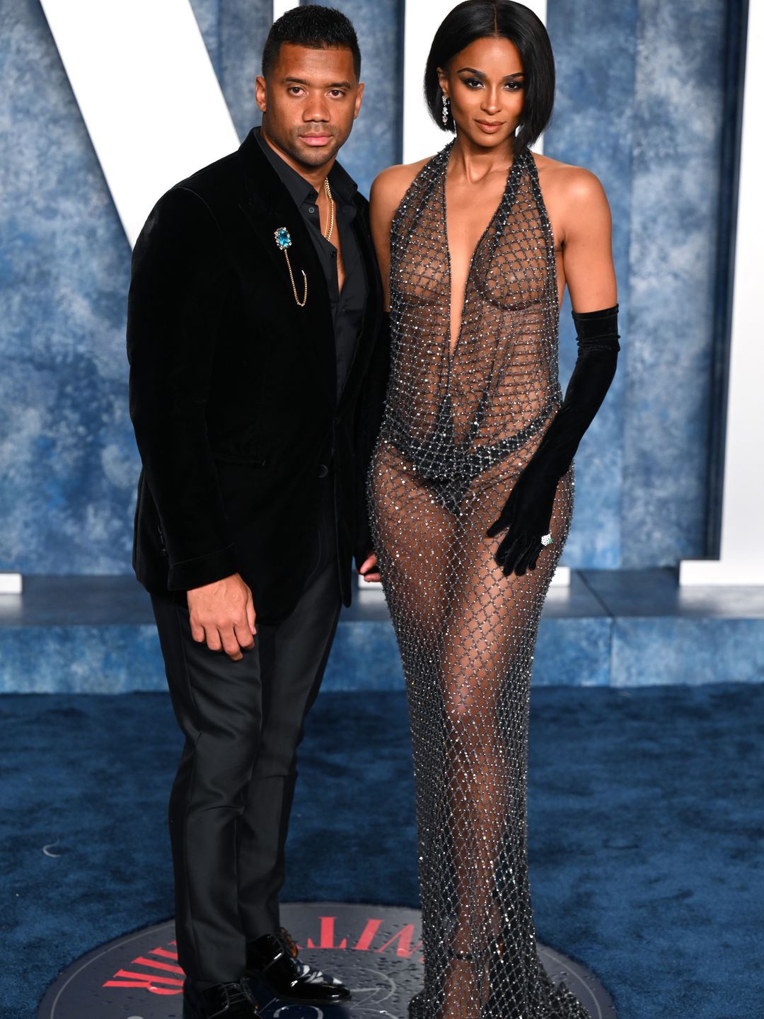 Ciara and Russell posing for photos on the Oscars afterparty red carpet