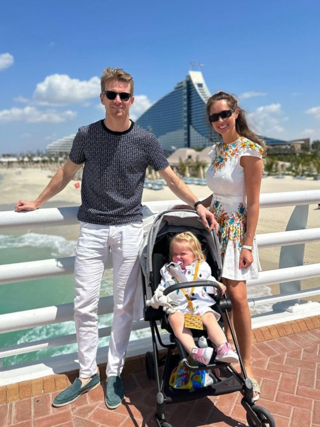 Nico Hulkenberg with wife and daughter on the beach