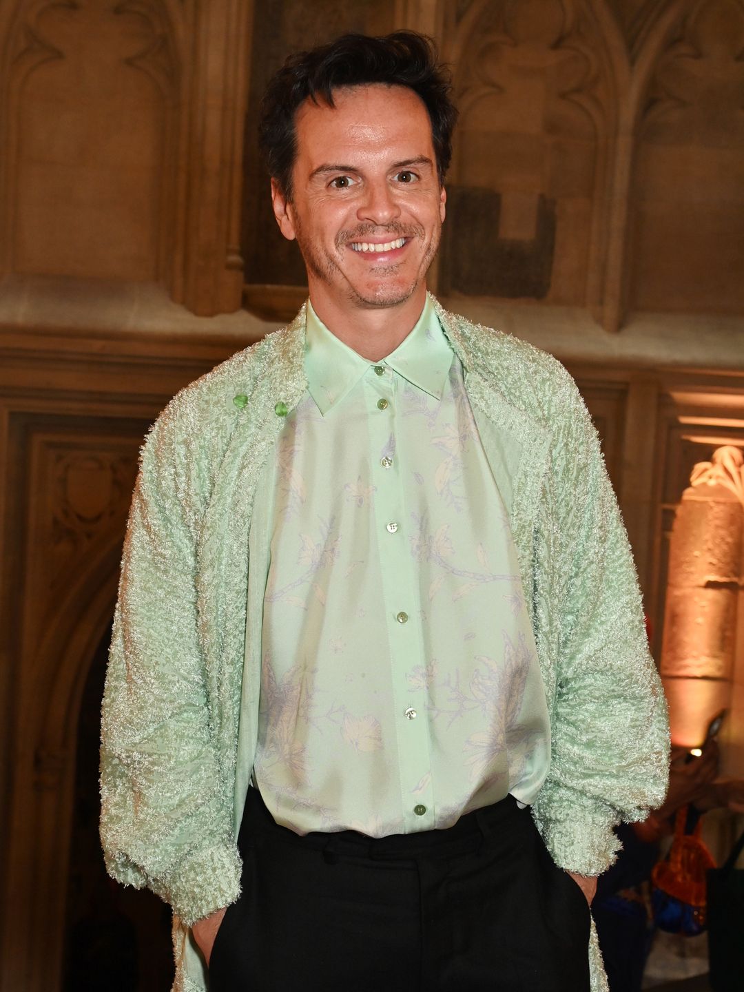Andrew Scott attends the Mithridate AW24 Show in. a pastel green shirt and coat 