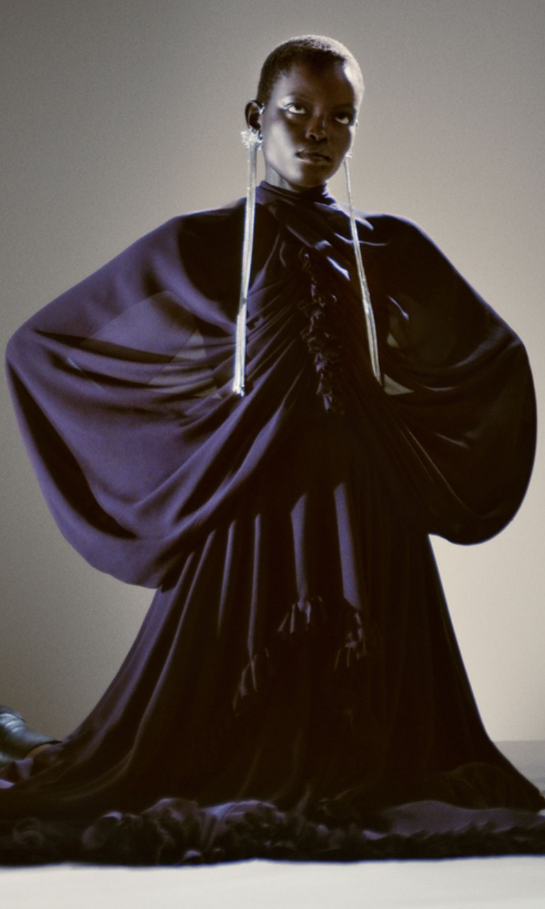 model in aubgerine purple gown