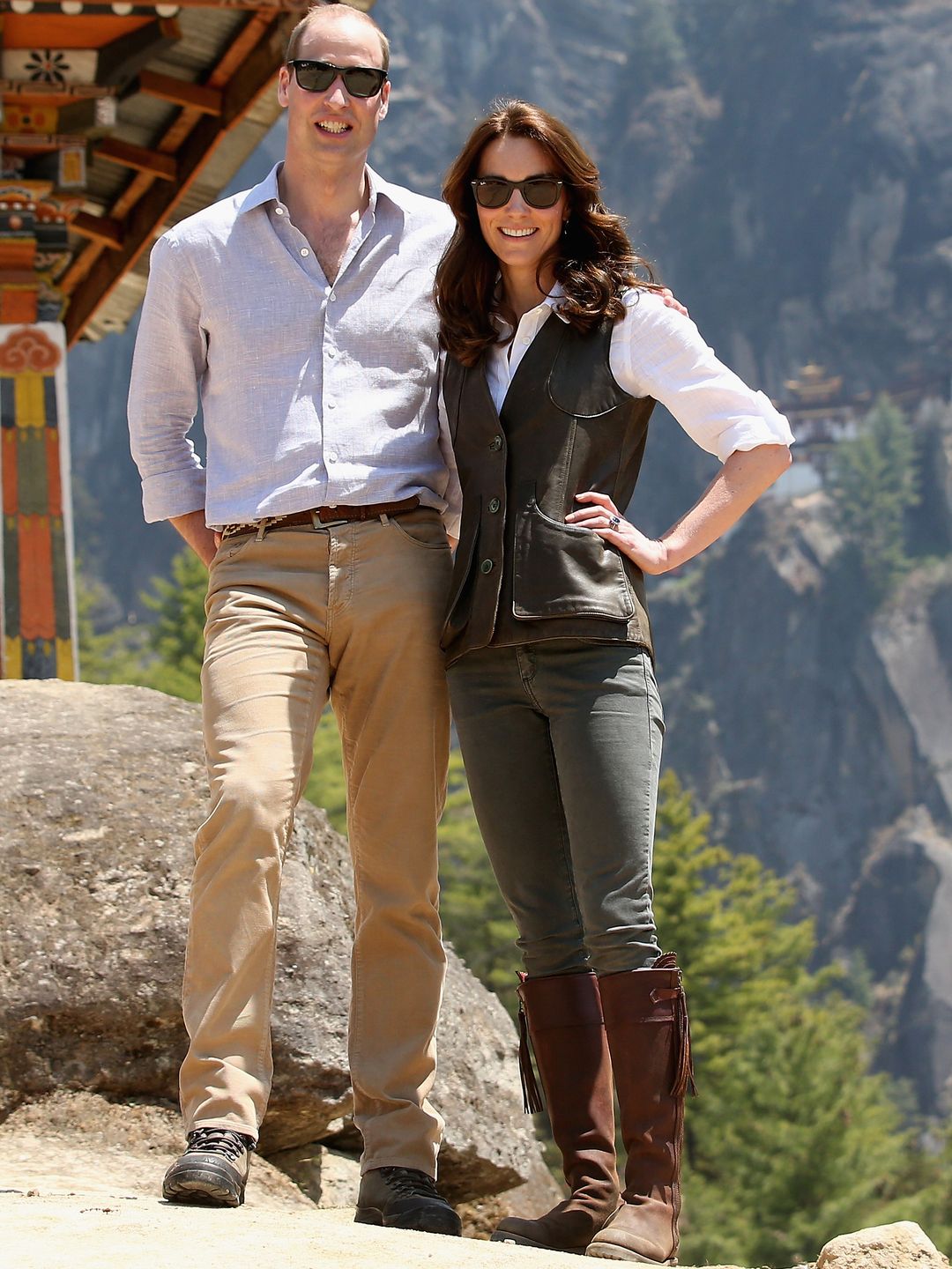 Prince William in sunglasses with his wife Kate Middleton in boots