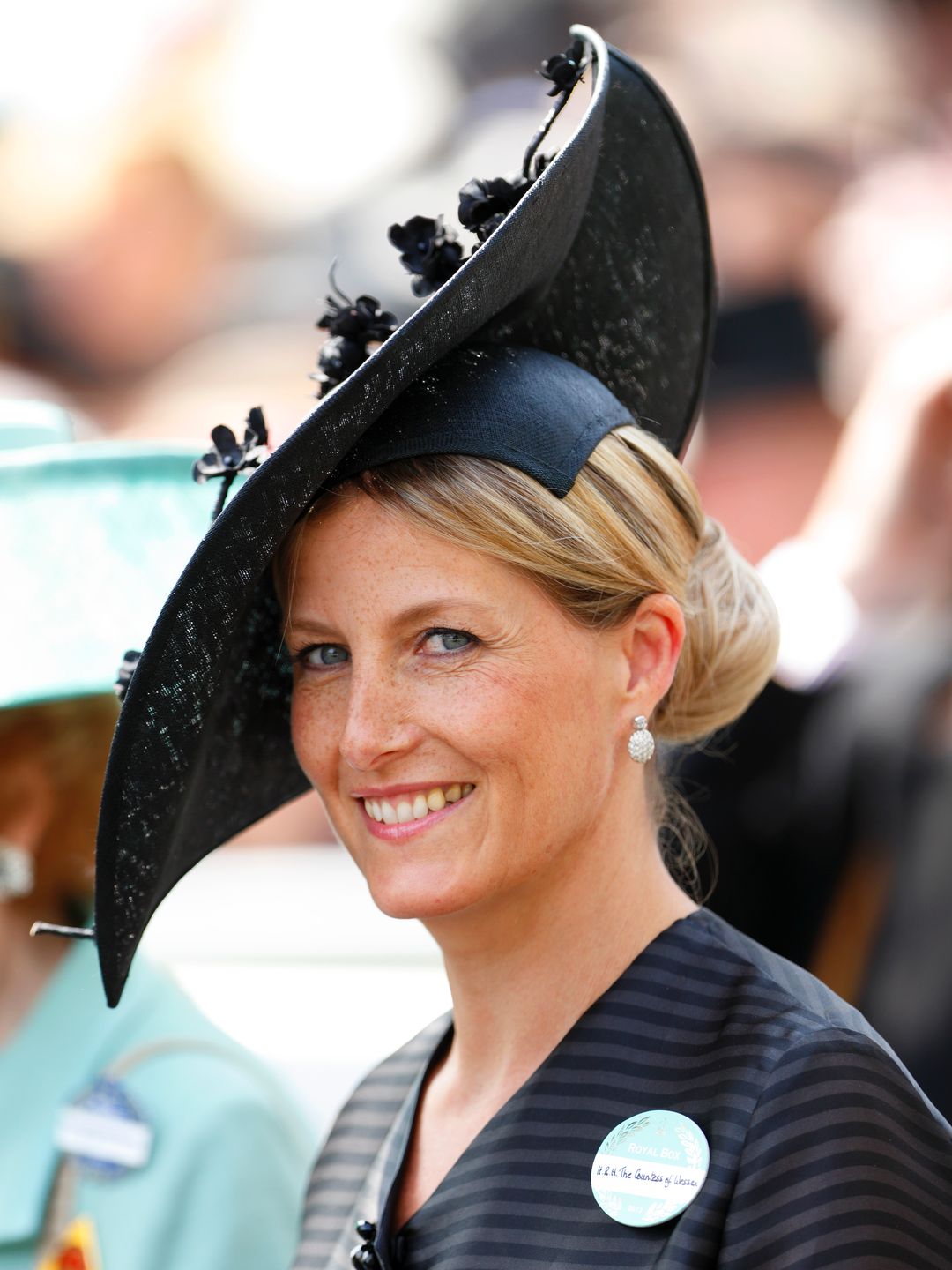 woman wearing black hat at ascot 