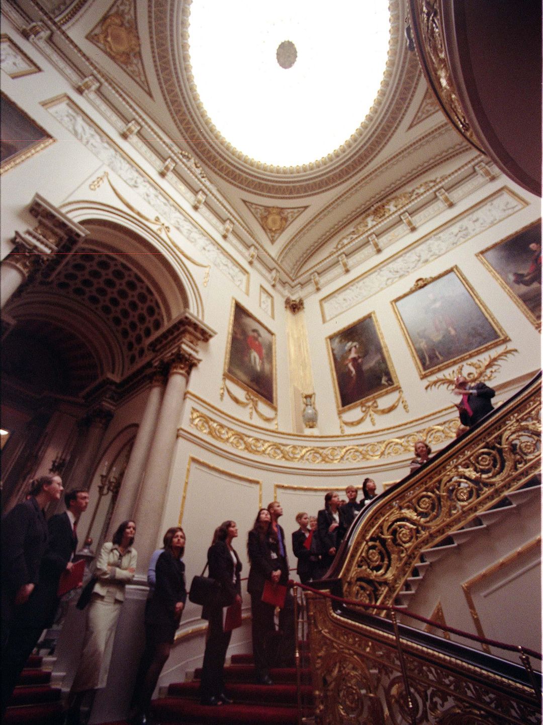 Guests climbing the Grand Staircase in Buckingham Palace