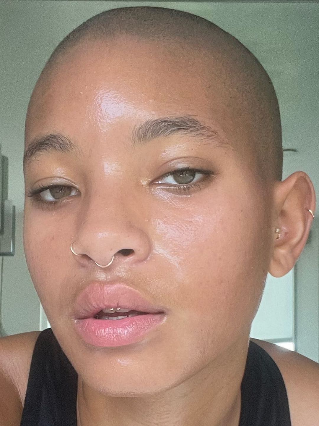 Willow Smith makeup free selfie with a bald head