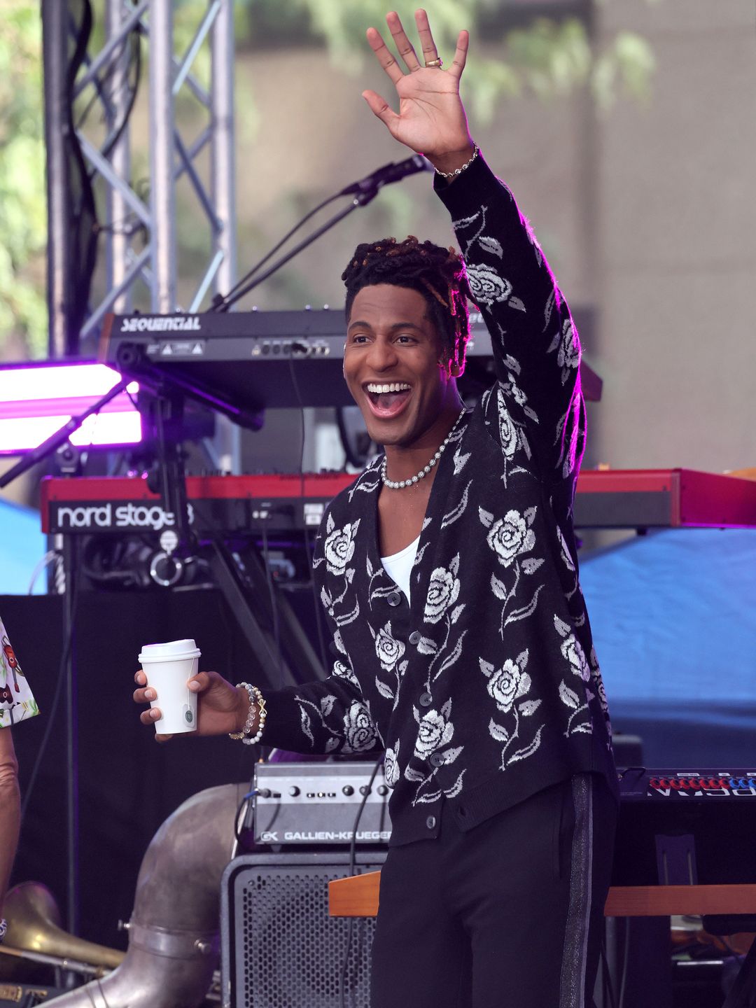 Jon Batiste waving to fans and smiling as he prepares to perform on NBC's 'Today' at Rockefeller Plaza on August 18, 2023